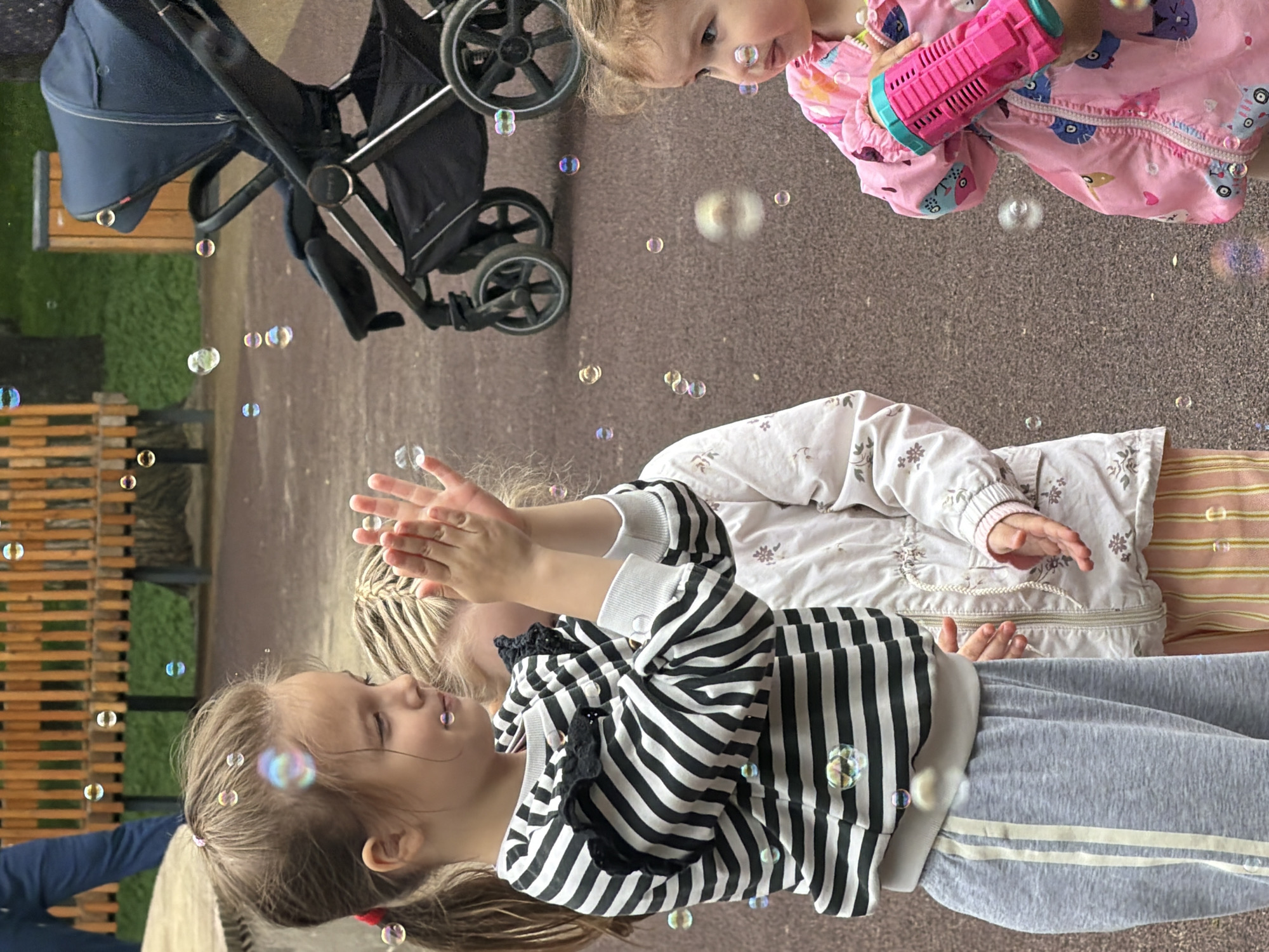 Young girls play with bubbles at Saratov playground