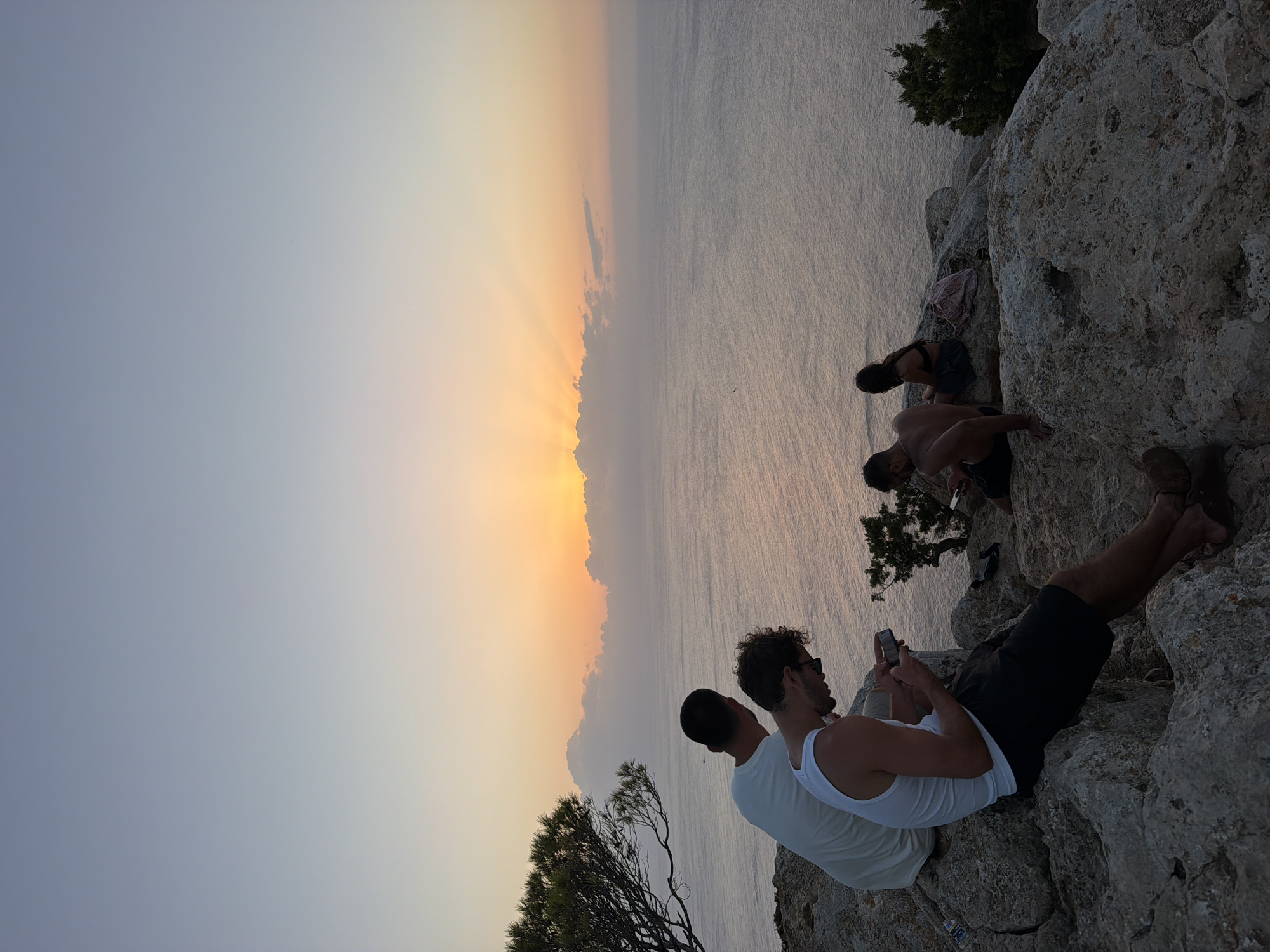 Sunset over Sant Antoni's rocky coastline, from clifftops to open sea