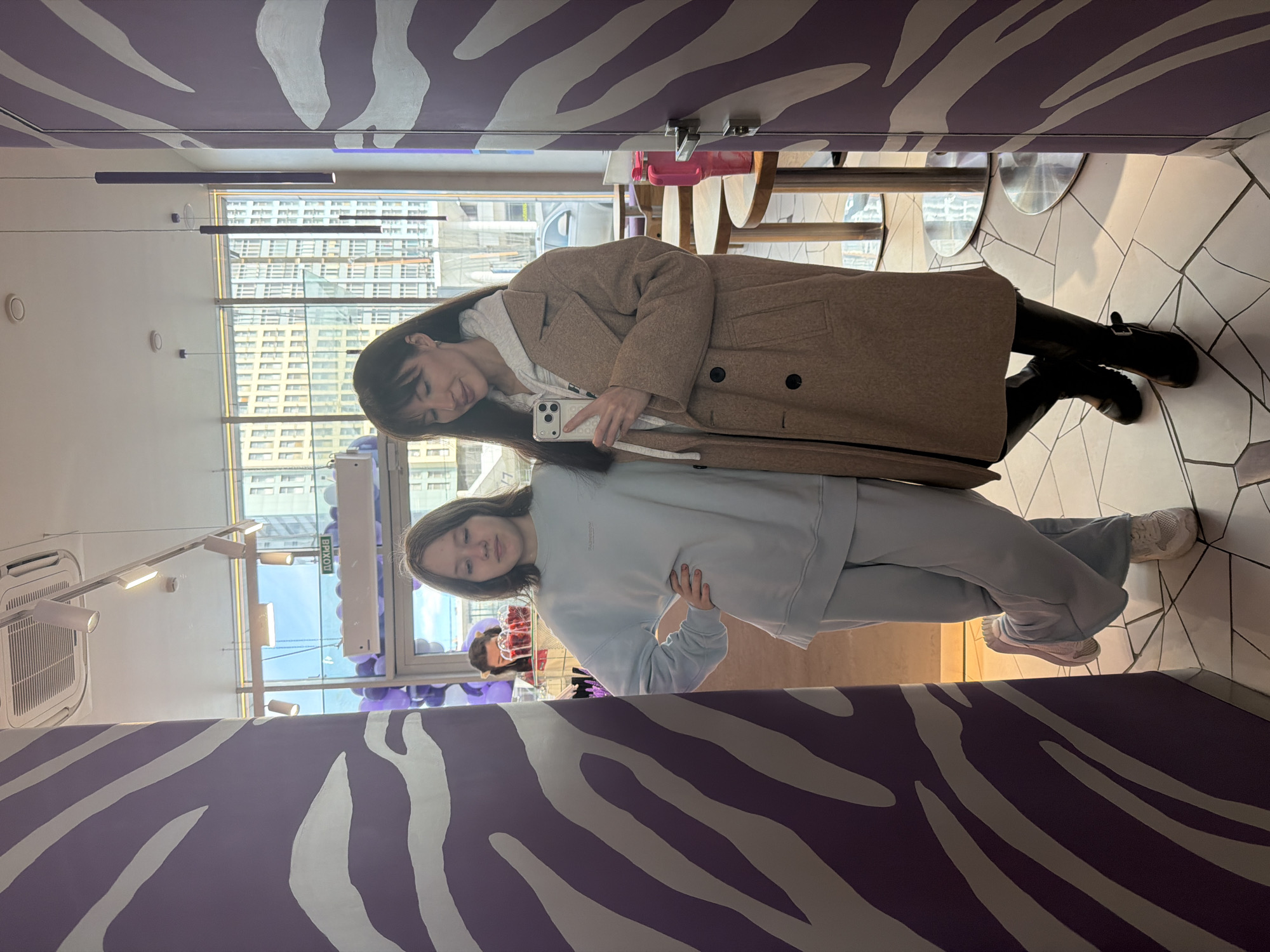 Young people socialize at purple-striped cafe in Perm, Russia