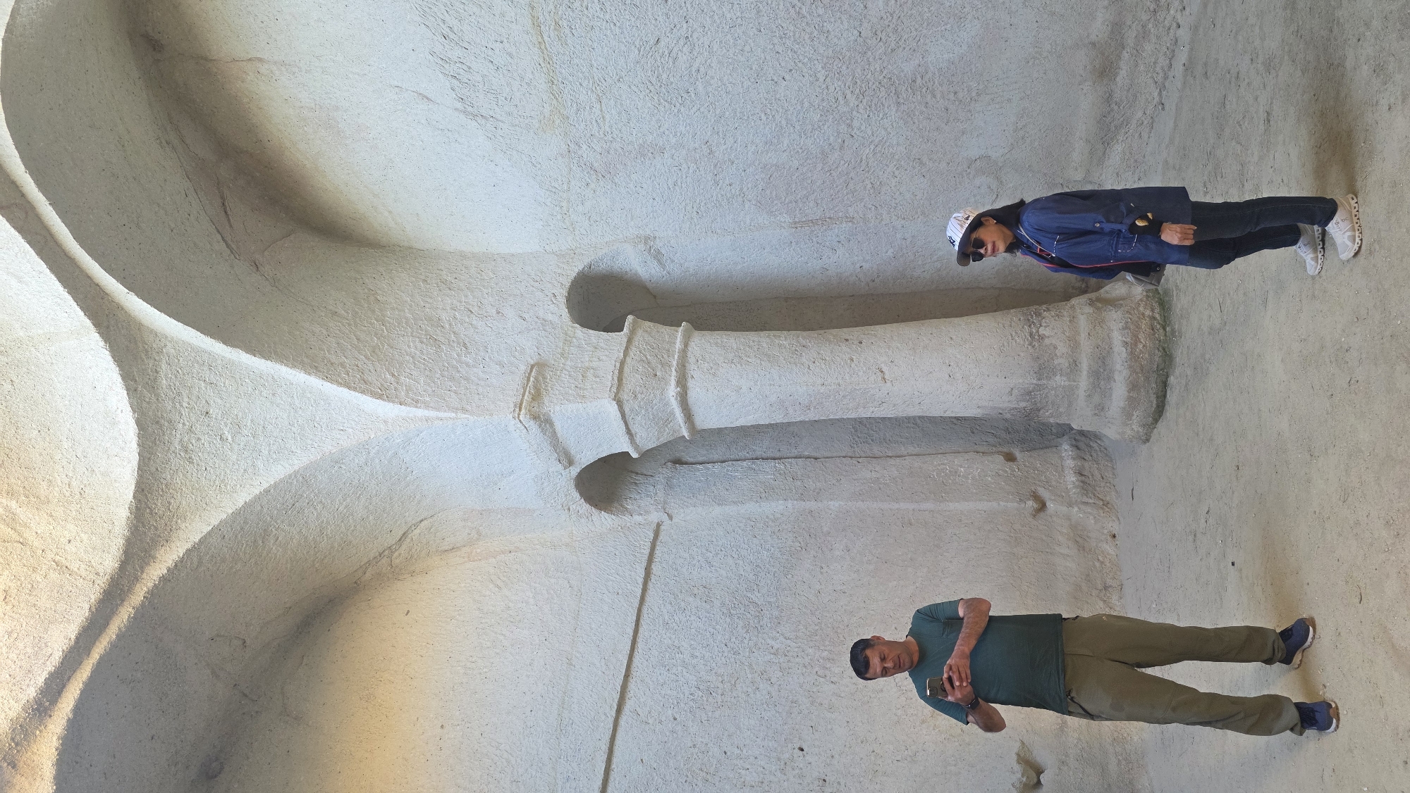 Tourists explore ancient rock-cut churches in Ürgüp, Turkey