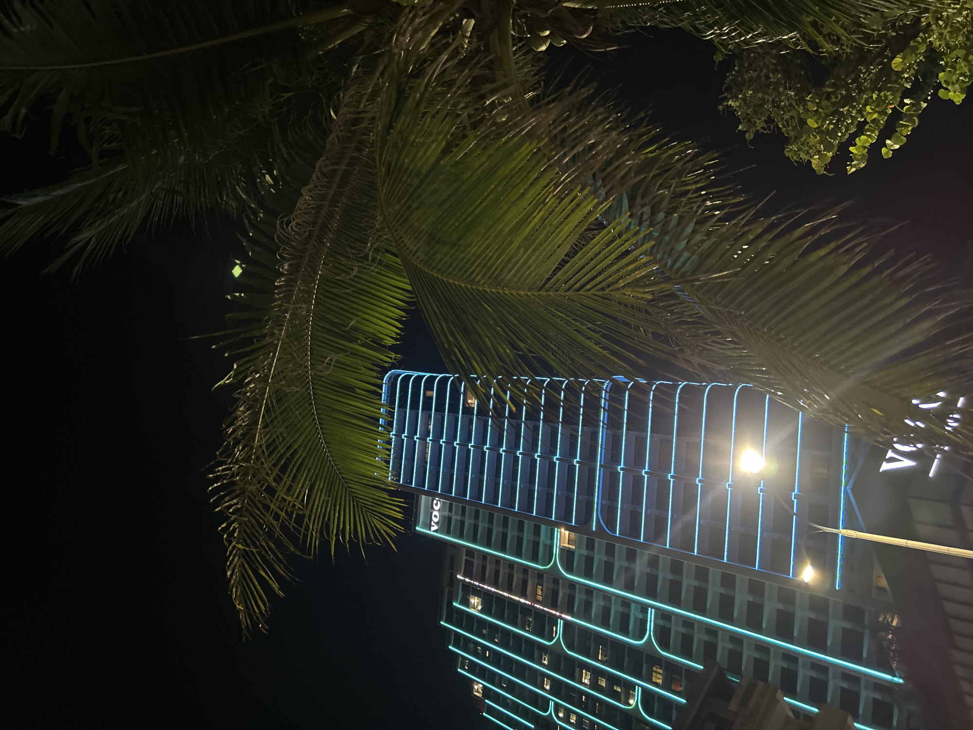 Neon-lit buildings captured at night in Bắc Nha Trang