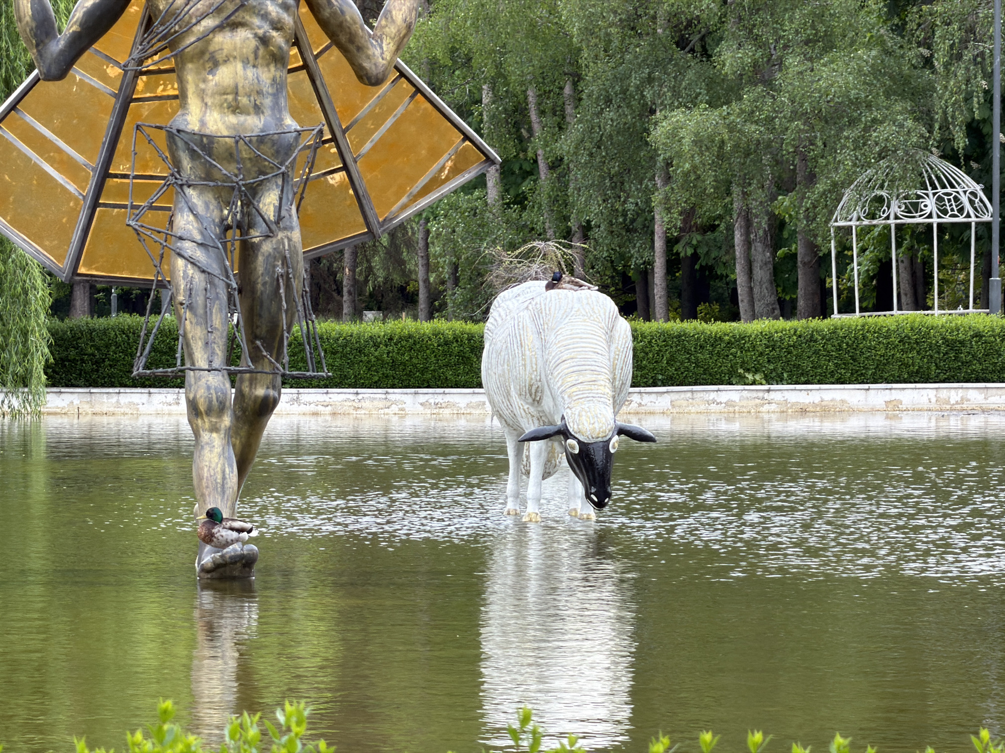 Art sculptures and carousel documented in Sofia park pond