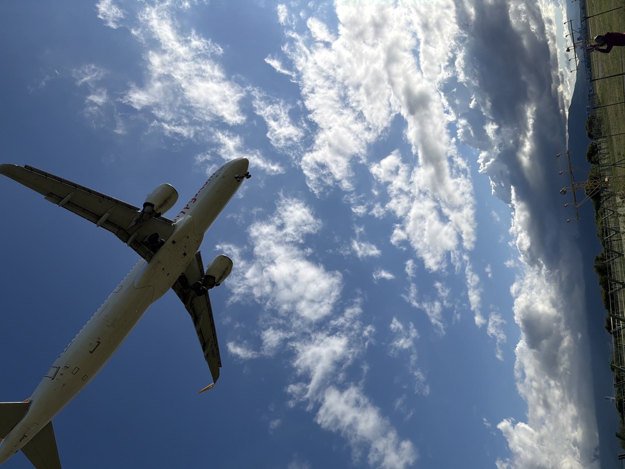 Commercial jet approaches Sofia Airport with landing gear deployed