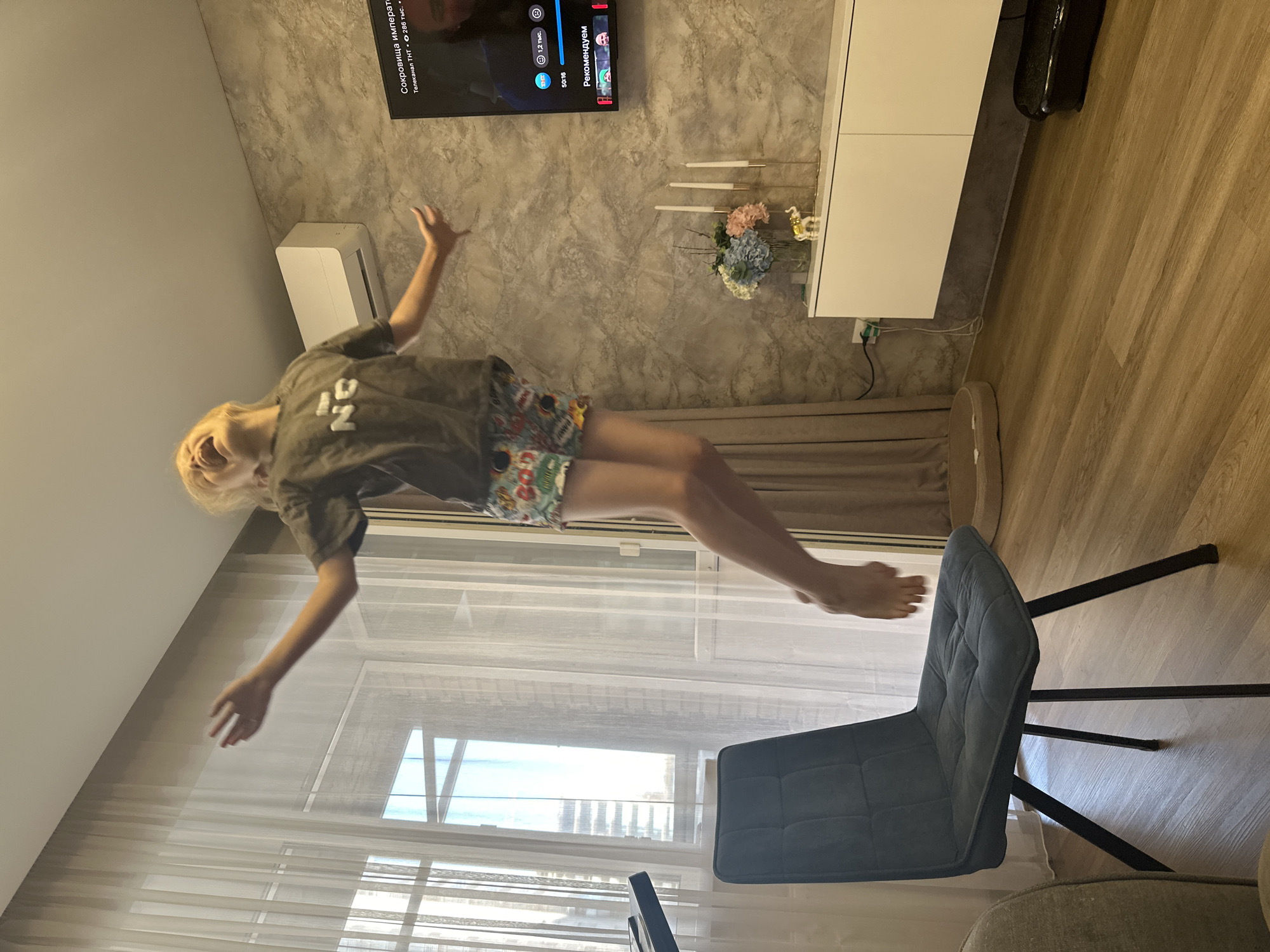 Jumping around a Abakan living room with the cats watching