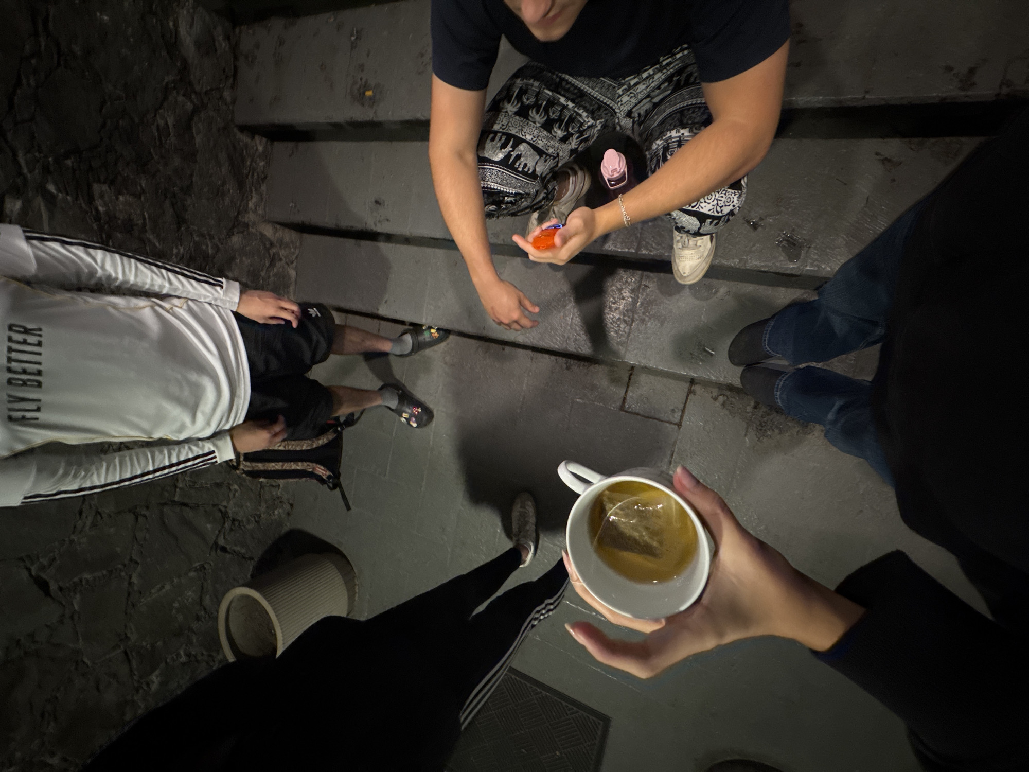 Late-night social gathering documented on Mexico City steps