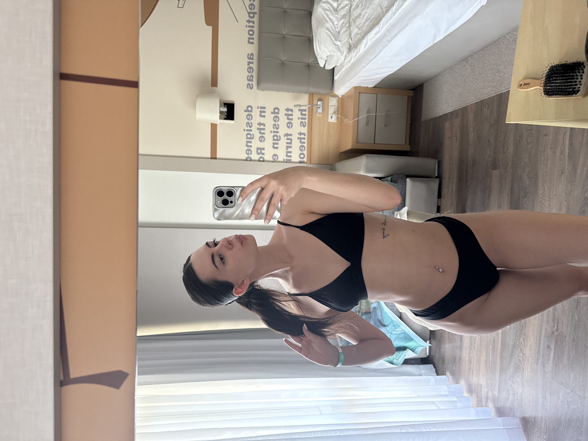 Woman Takes Hotel Mirror Selfies in Black Bikini