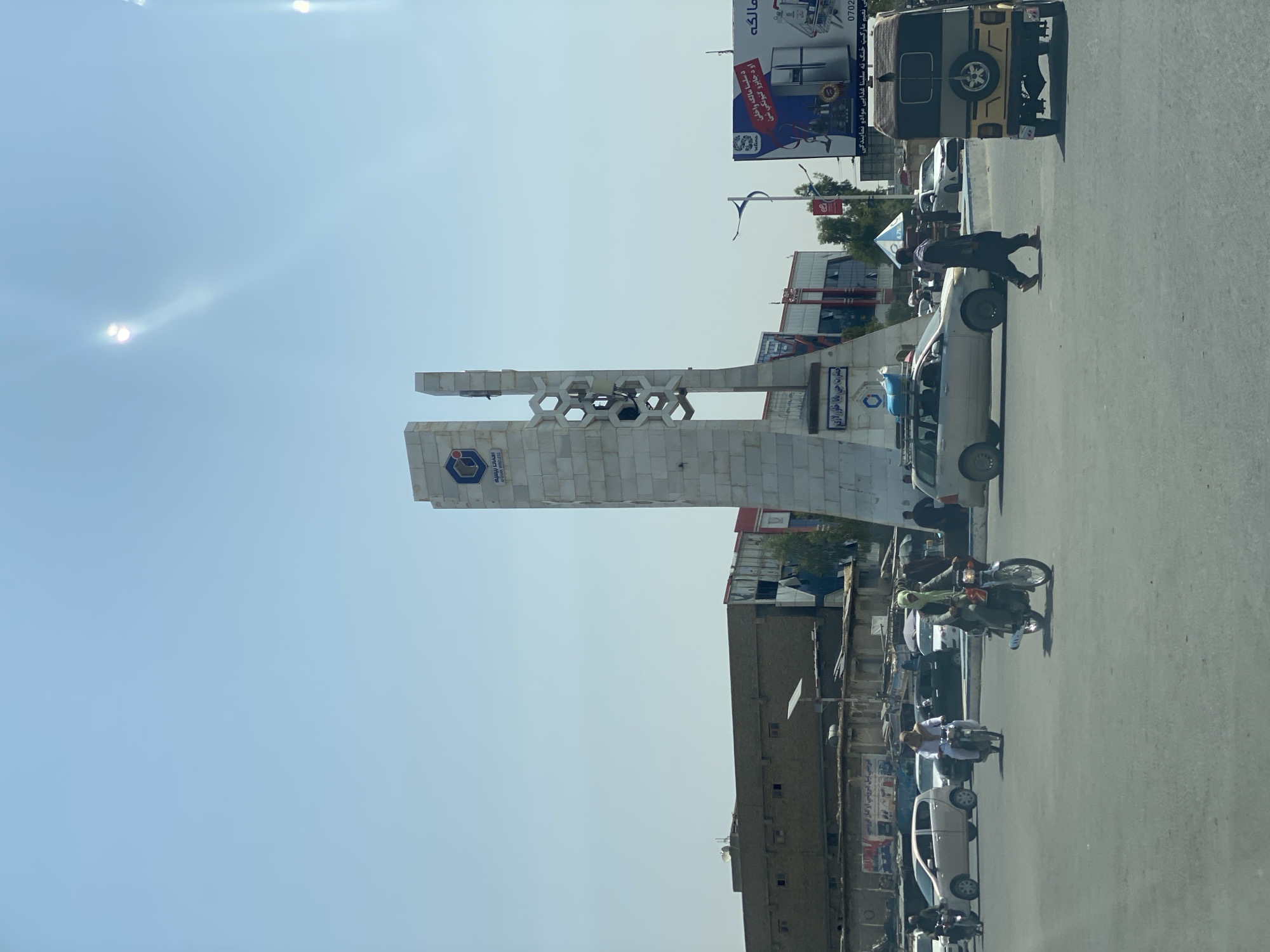 Street life near a central monument in Kandahar