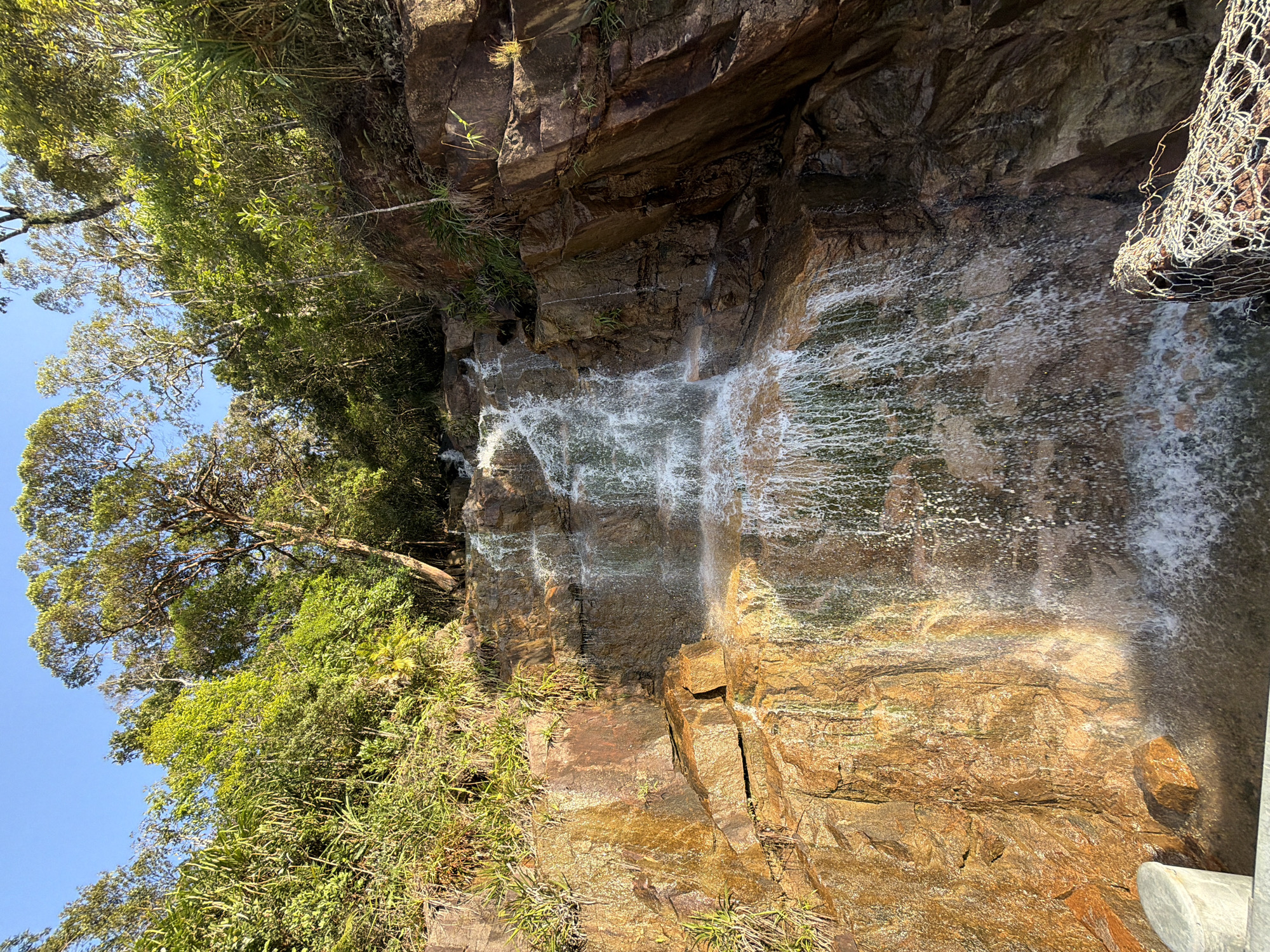 Tiered waterfall with rocky cascade in Nam Khanh Vinh, Vietnam