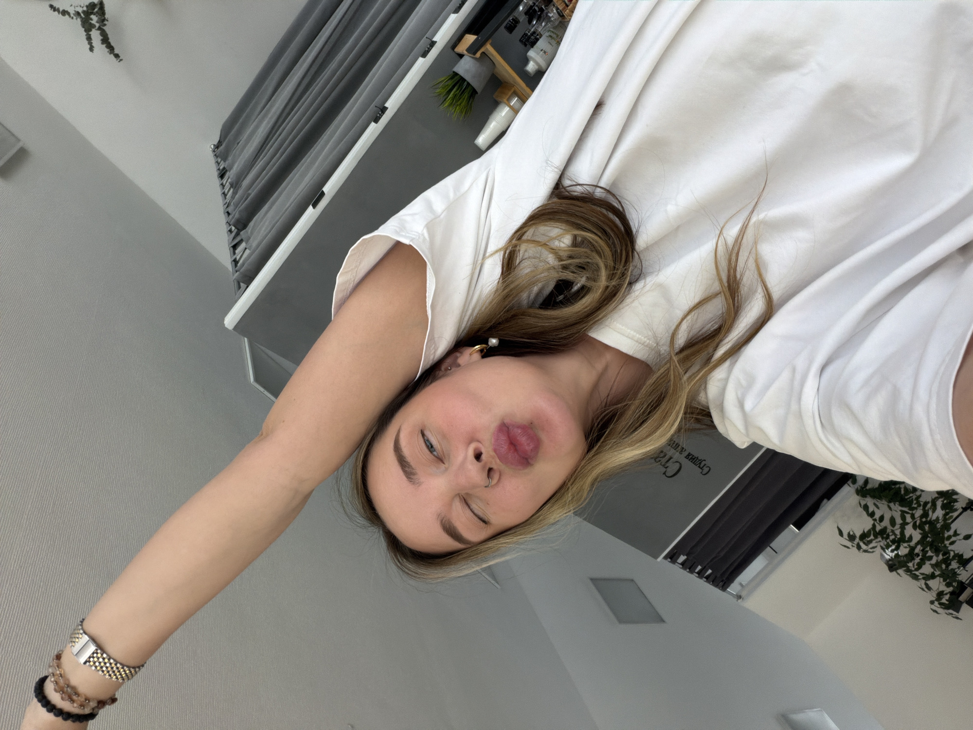 Woman takes multiple selfies across Chaikovsky, Russia morning