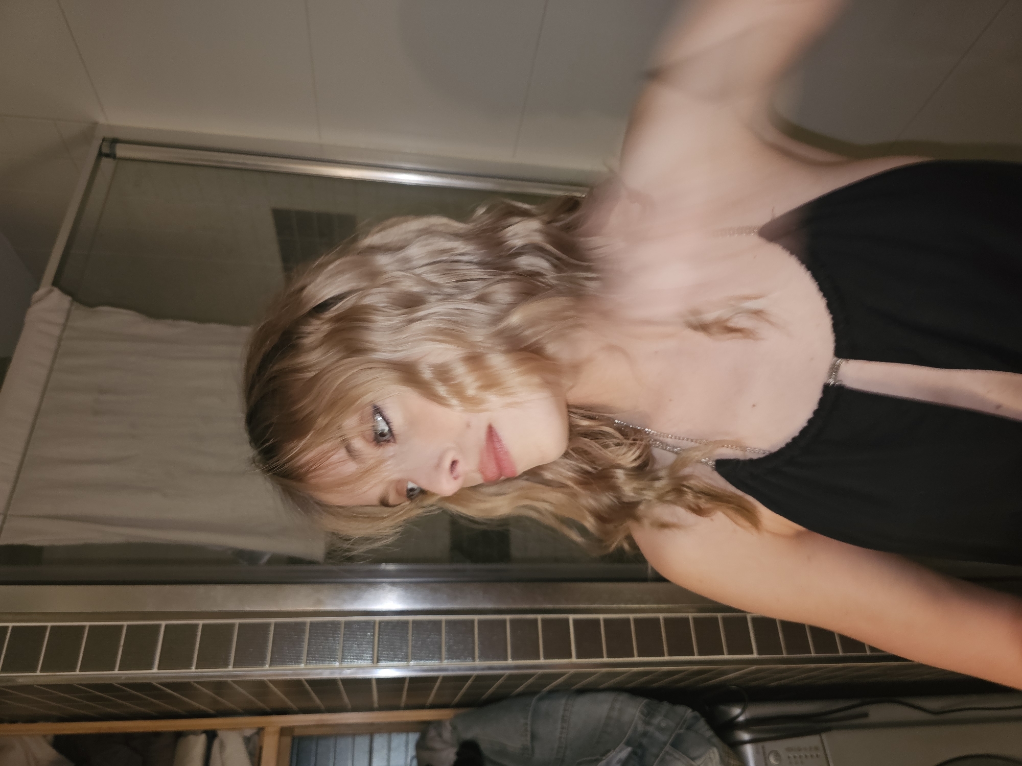 Blonde woman in pensive pose captured at unknown location