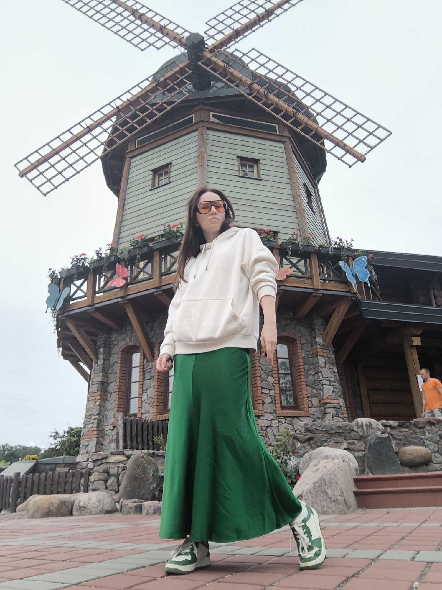 Woman photographed at windmill attraction in Riga, Latvia