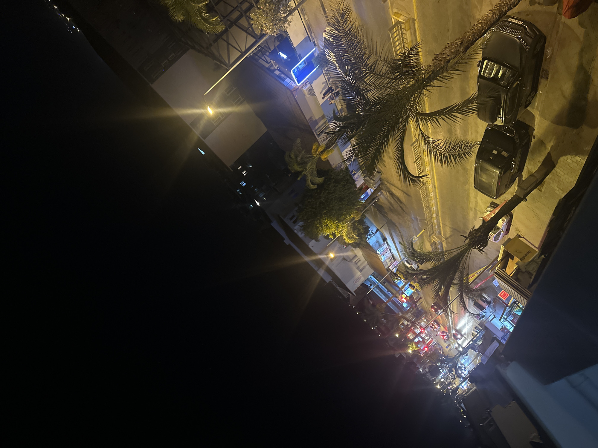 Fethiye streets at night, from intersection traffic to a glowing doorway