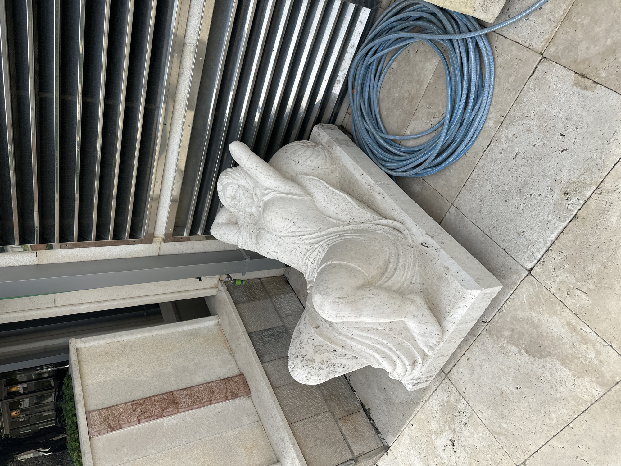 Tourist explores Montenegro coastal resorts, documents sculptures and spring blooms