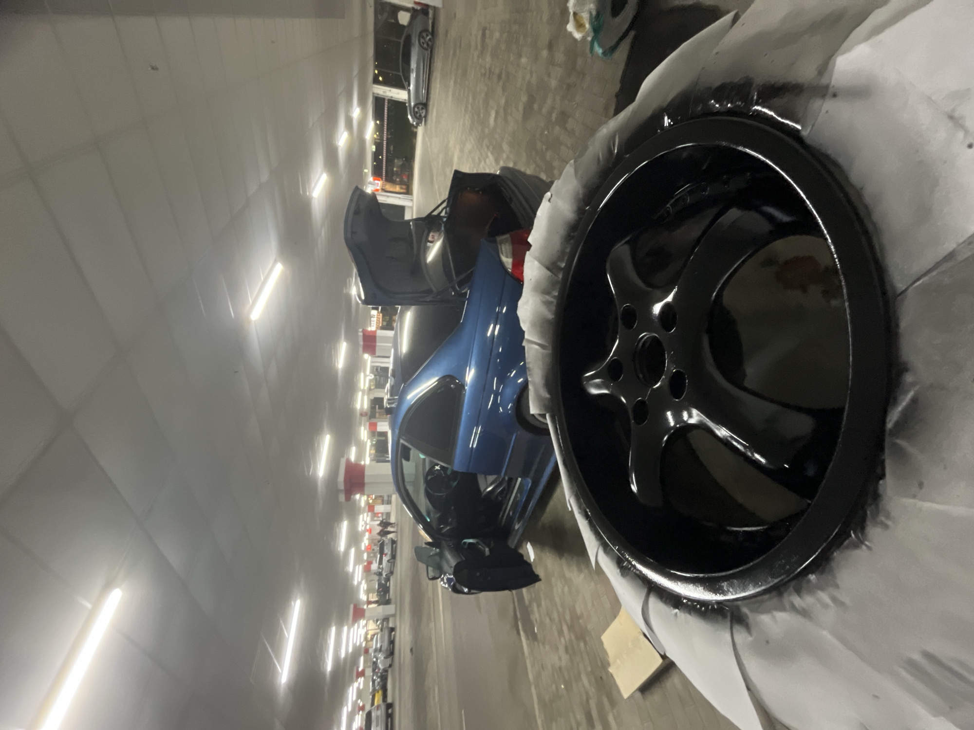 BMW parked with hood open in Varna parking garage