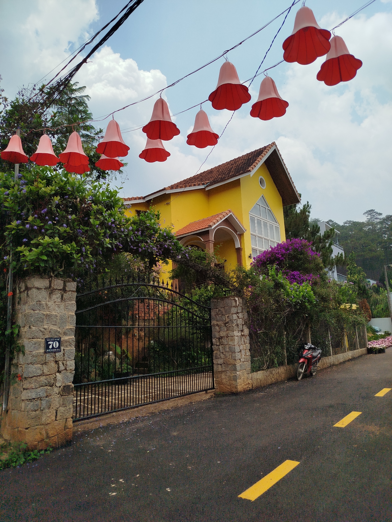 Yellow house with red roof documented in Hiep Thanh Vietnam