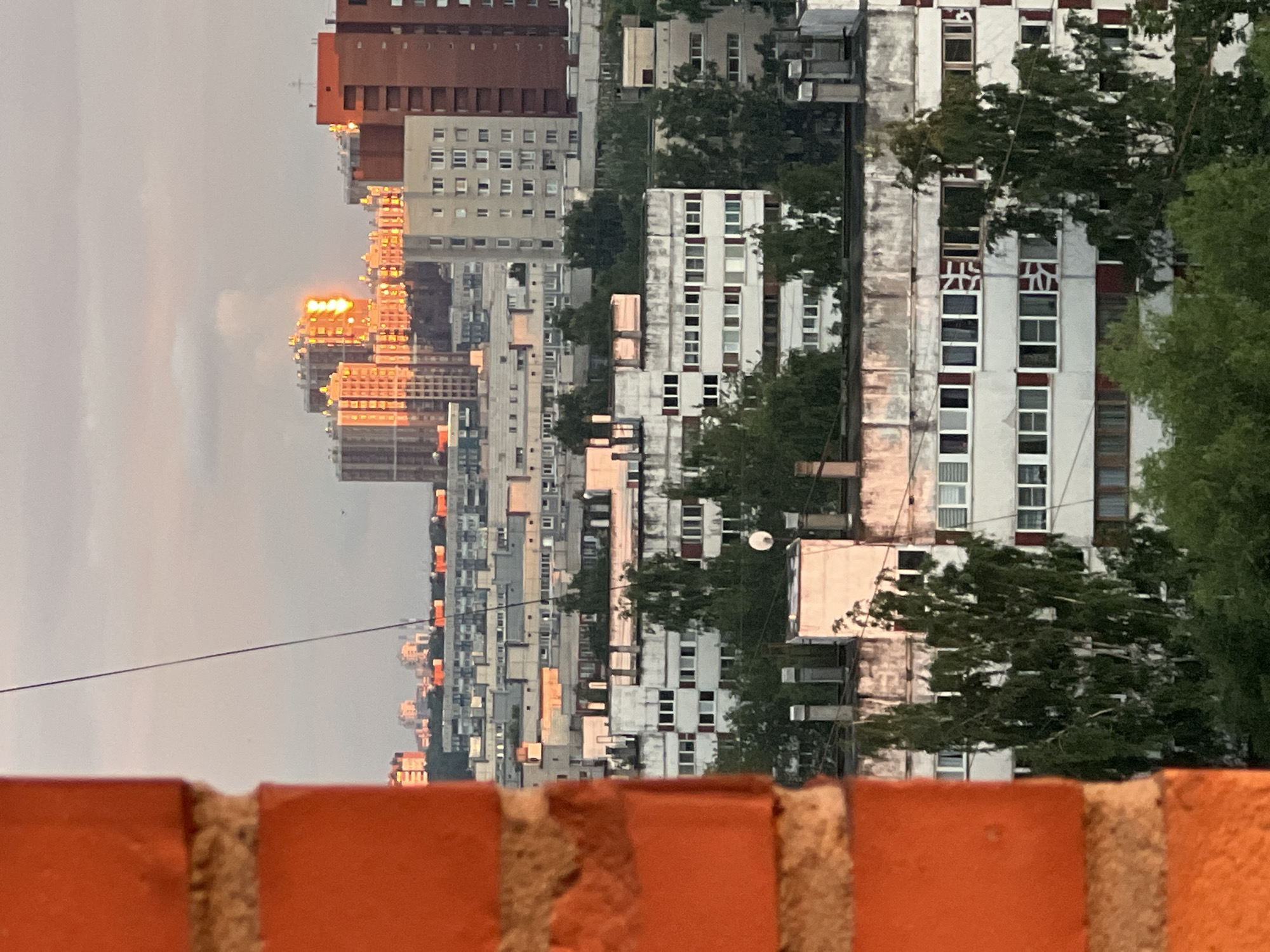 City skyline at golden hour, up close and from above