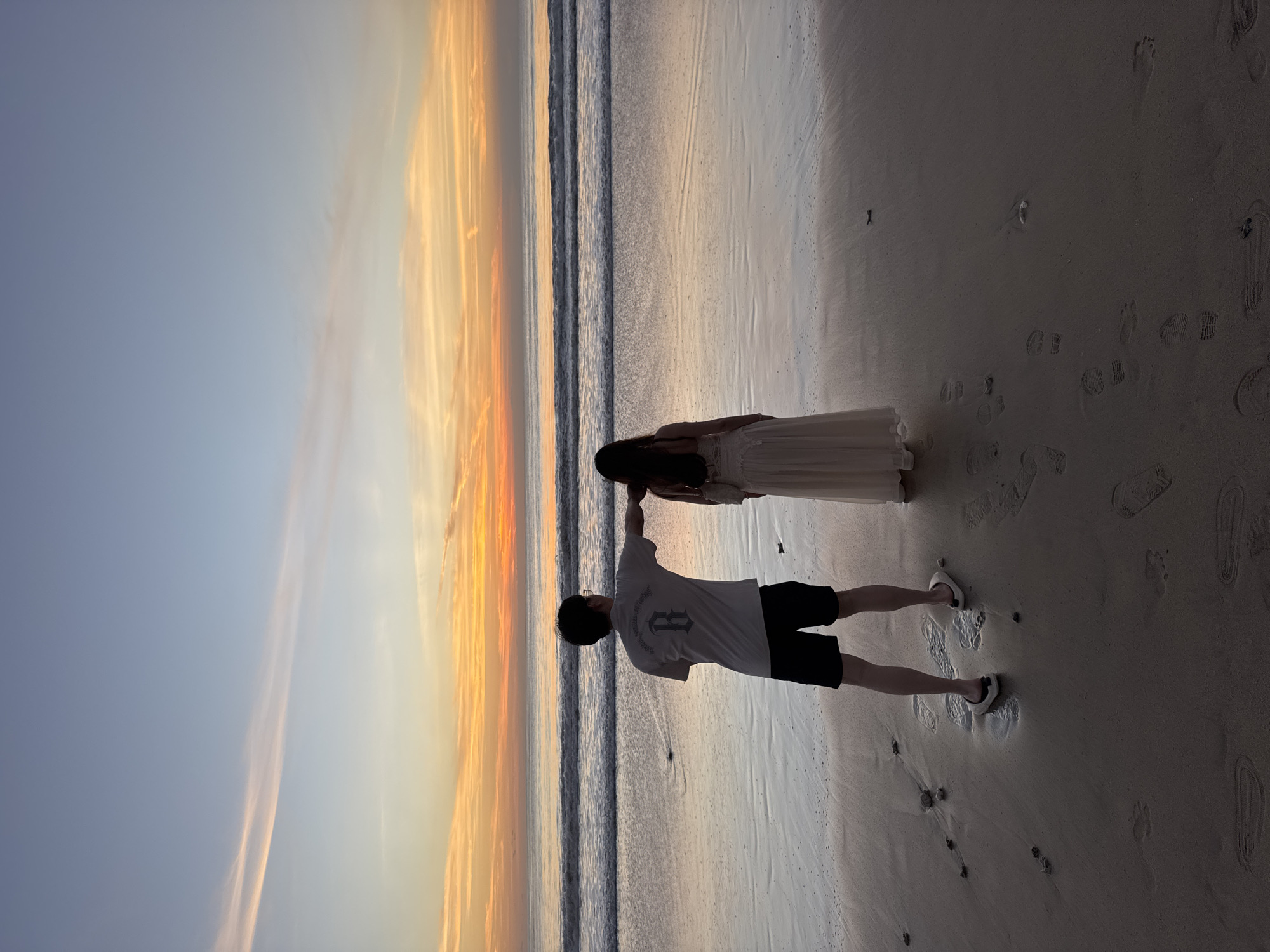 Sunset beach activities documented at Kuta Selatan, Indonesia