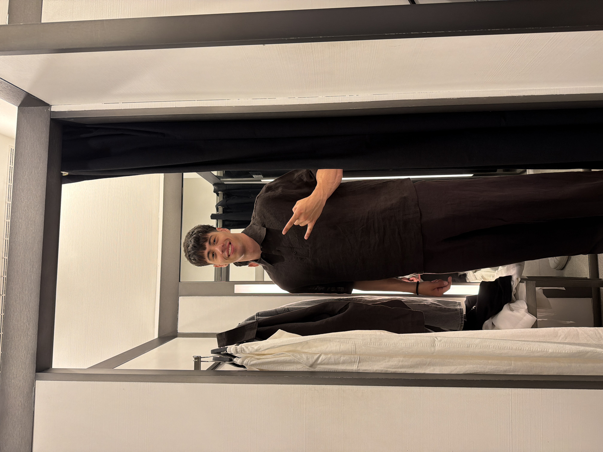 Man tries on clothes in Burgas fitting room