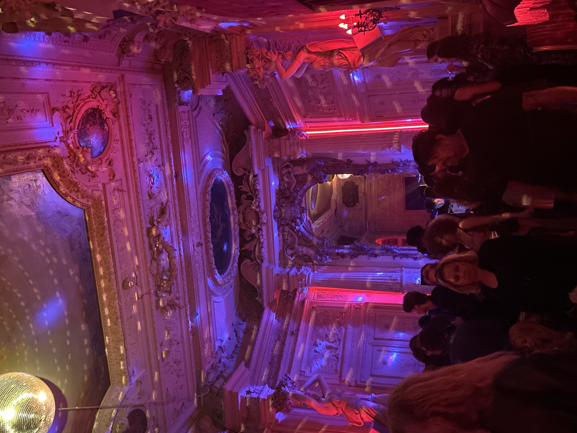 Late night gathering at ornate Paris nightclub venue