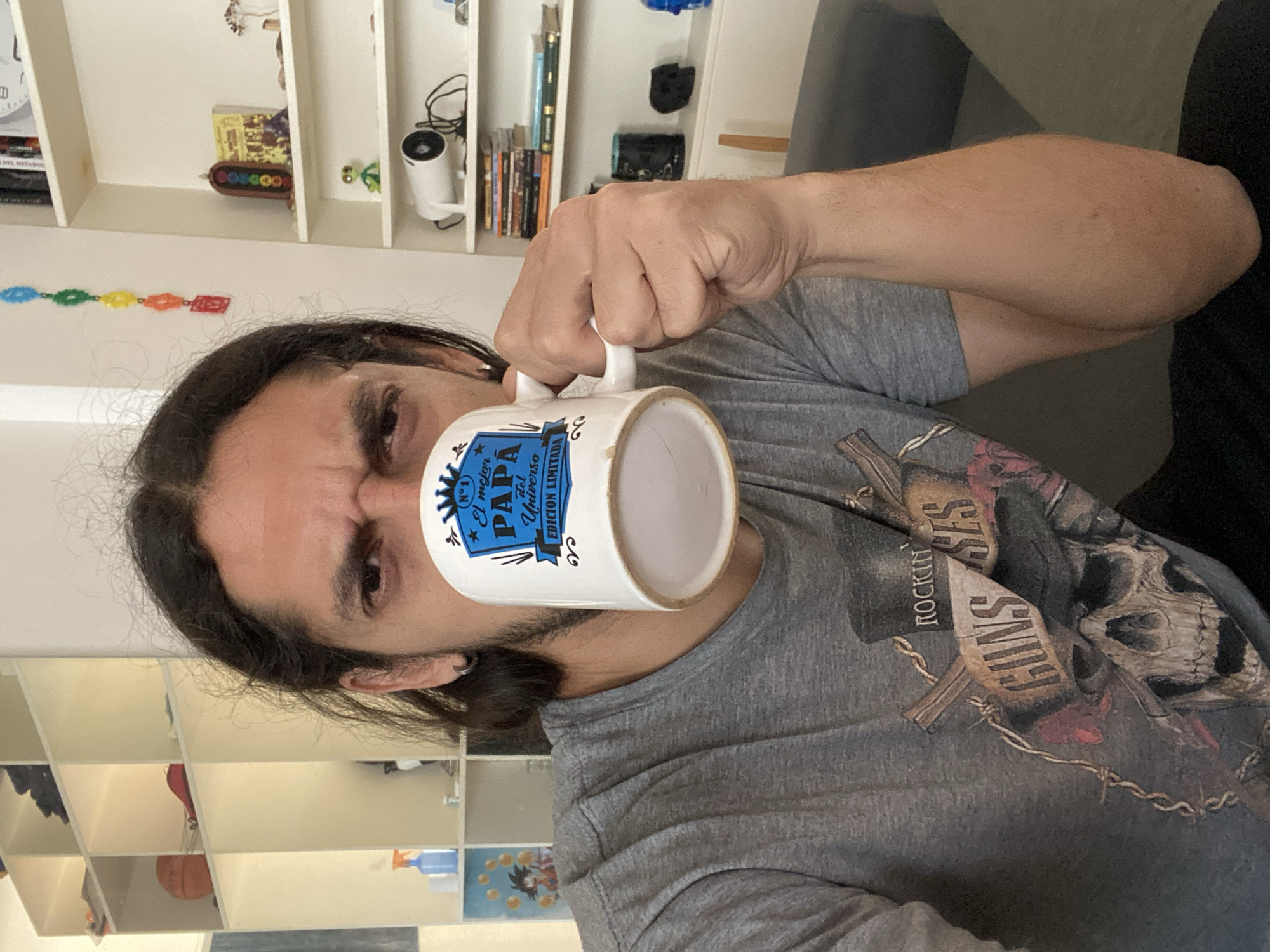 Man holds decorative mug in Buenos Aires