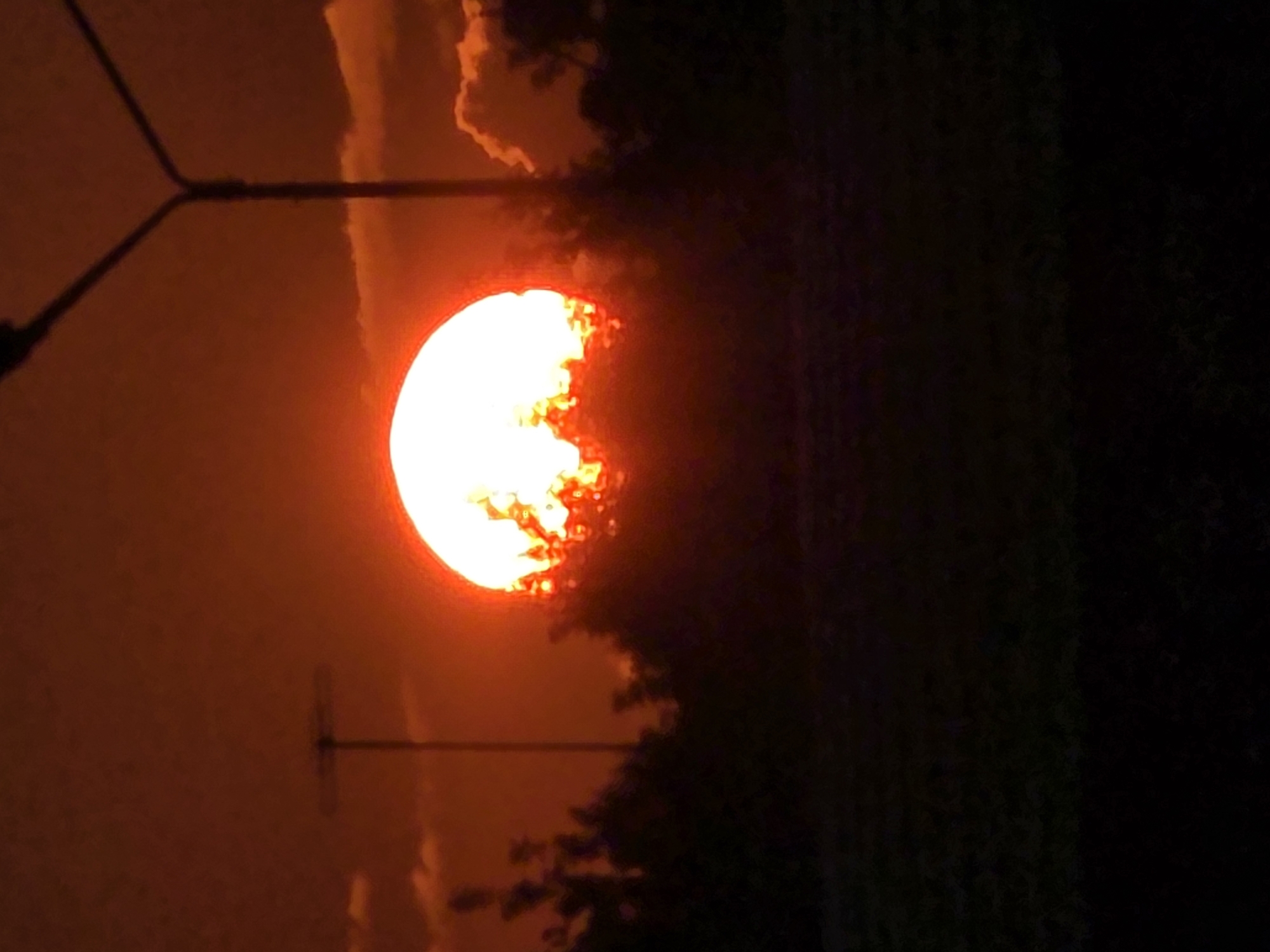 Vivid summer sunset over Chelyabinsk streets and parking lots