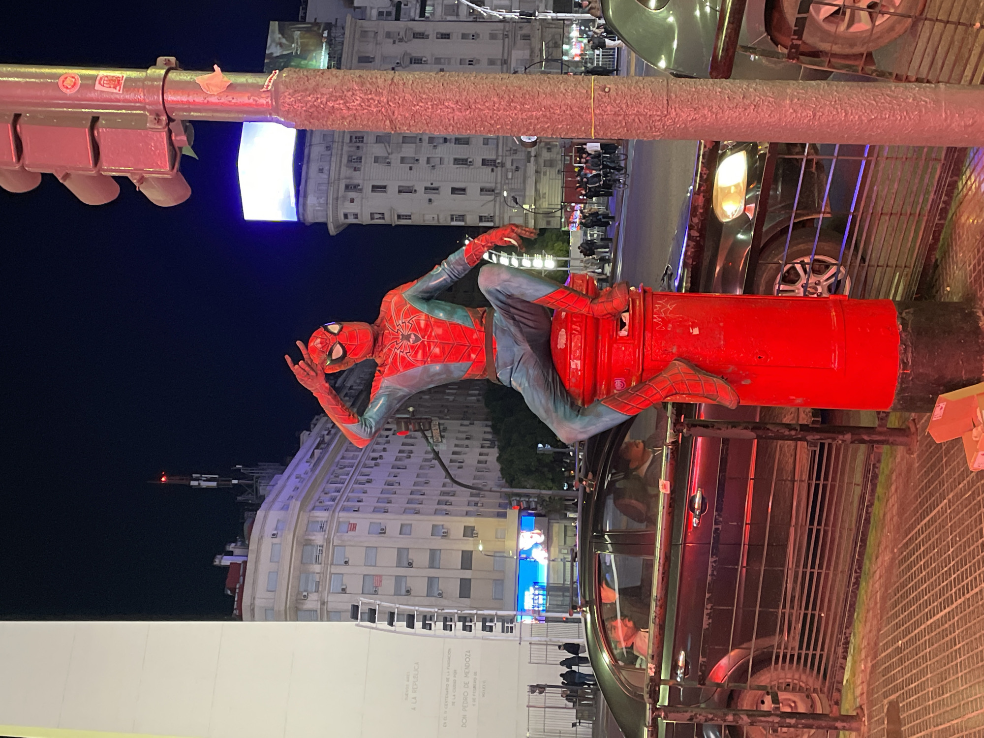 Spider-Man costumed performer spotted on Buenos Aires street fixture