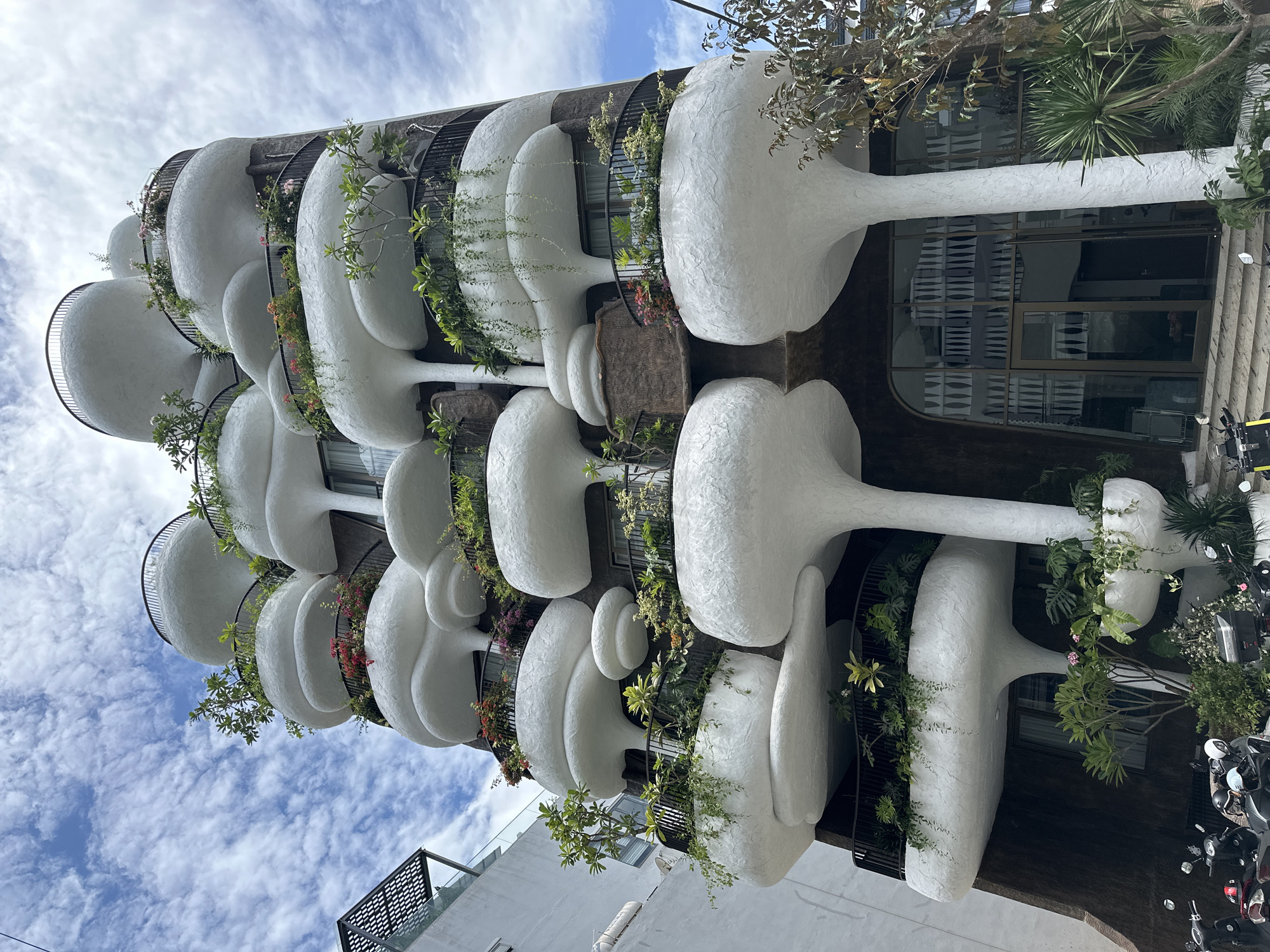 Da Nang's sculptural building with bulging balconies and trailing plants