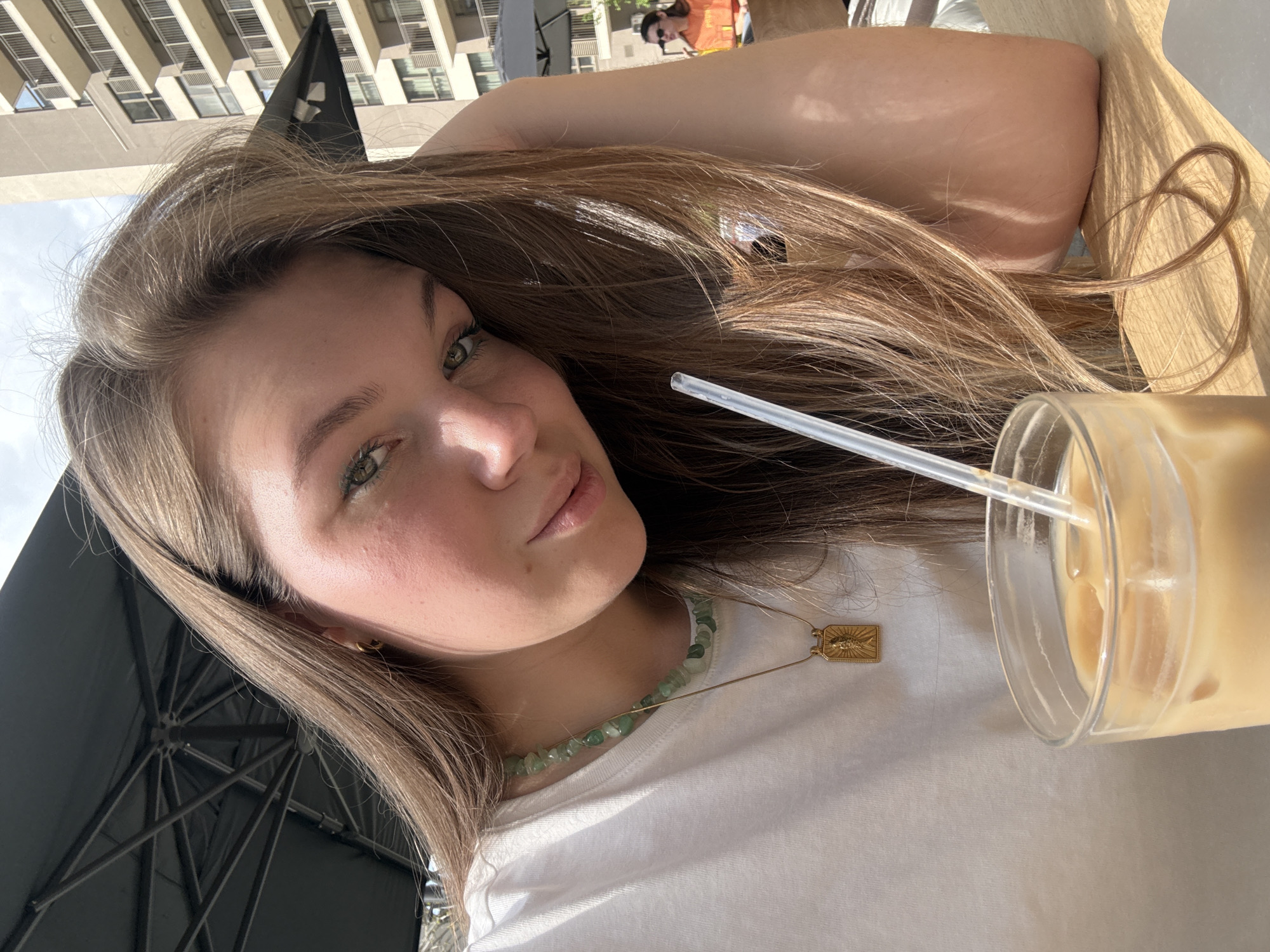 Woman enjoys sunny lunch at Belgrade cafe