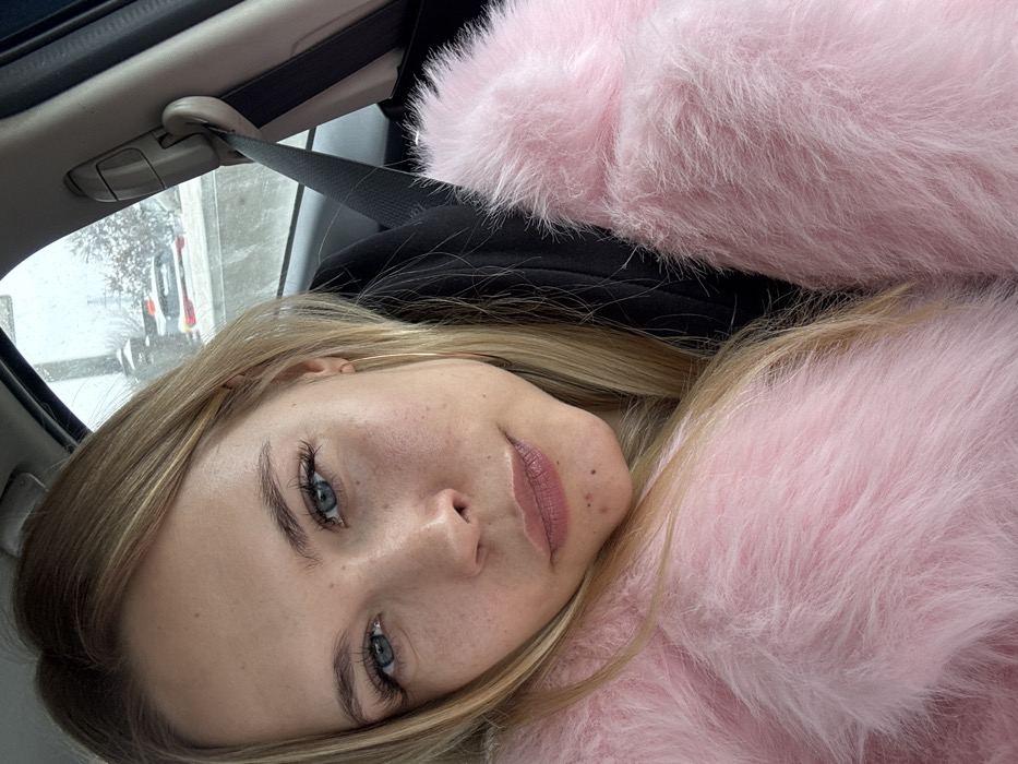 Portrait of blonde woman captured in vehicle, Moscow