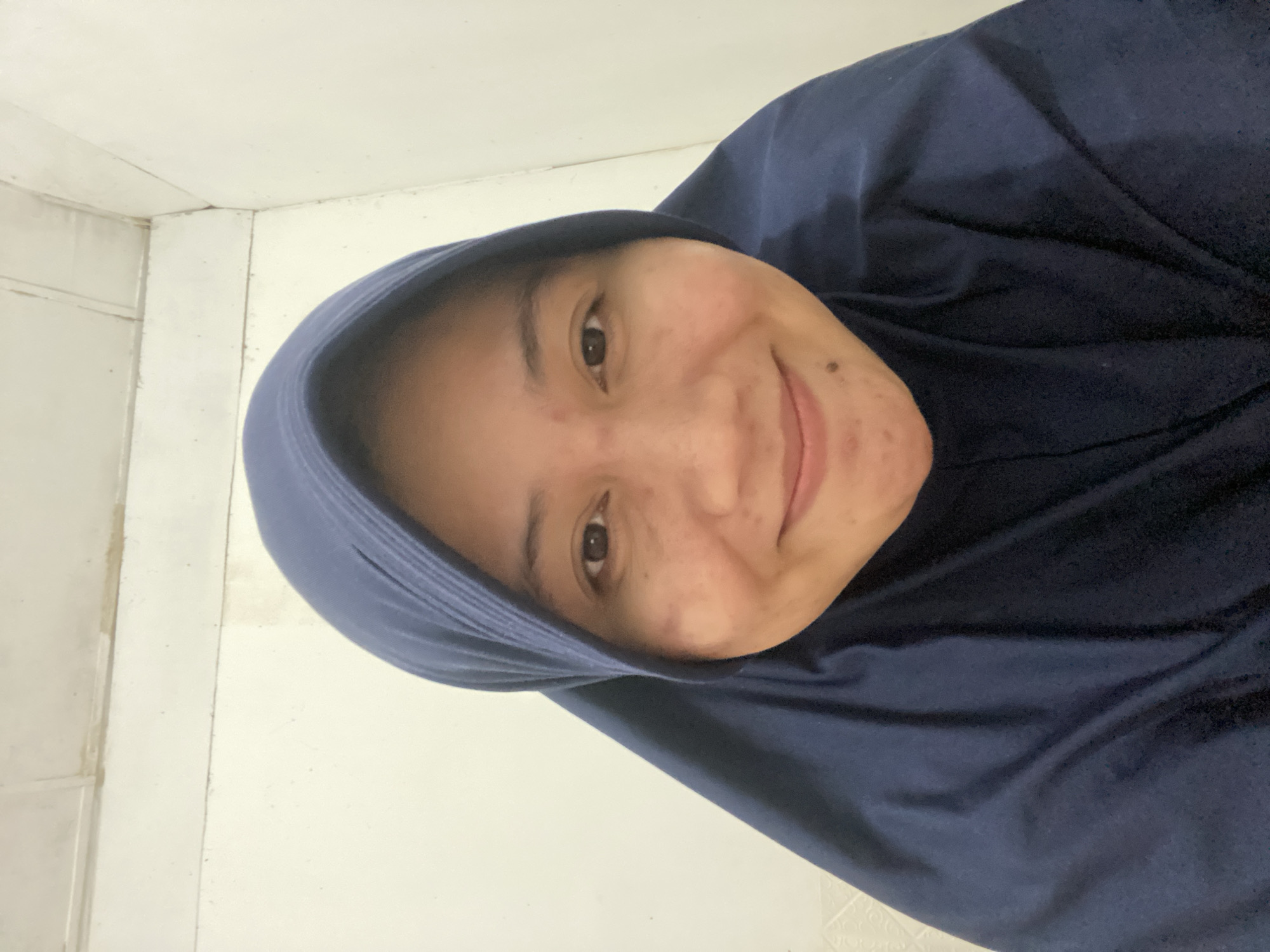 Indoor selfie session with skincare and a drink in Banjarbaru