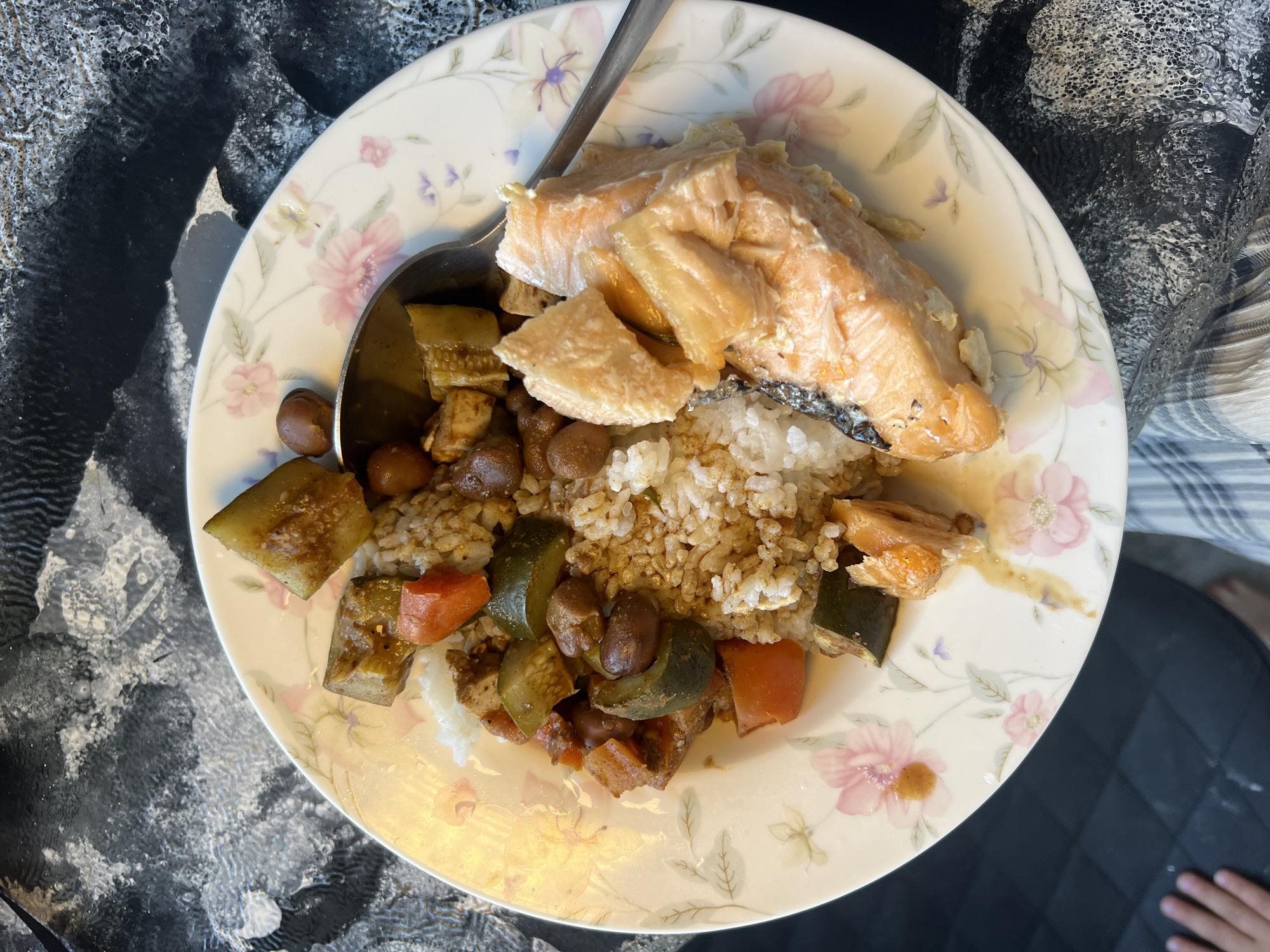 Salmon meal photographed on floral plate in Kiryat Bialik
