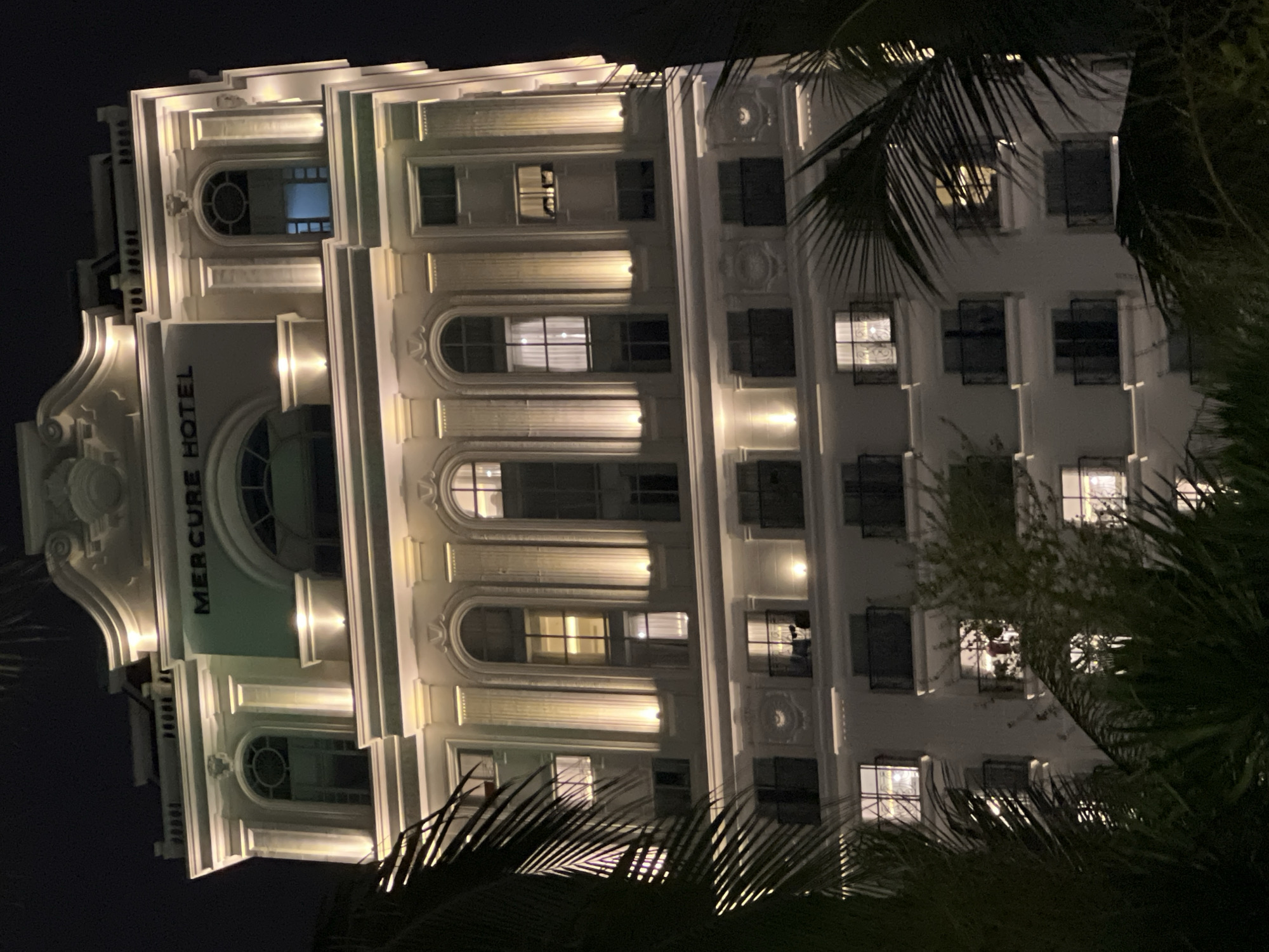 Nha Trang beachfront at night — statues, cafes, and lit streets