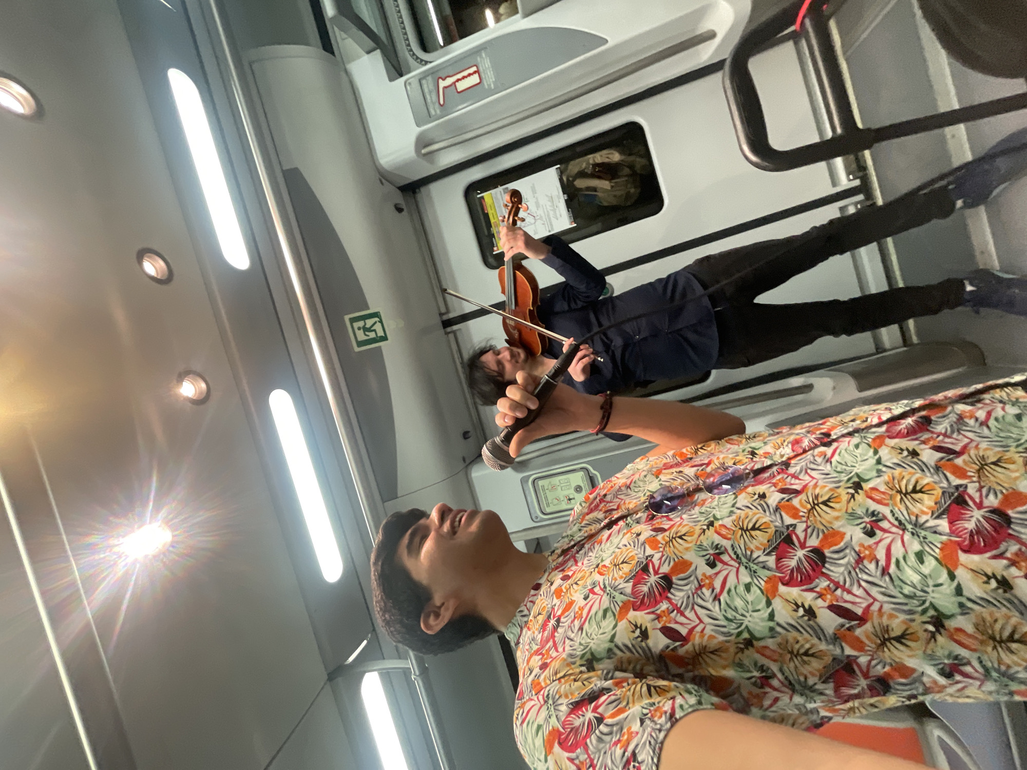 Street performers entertain passengers on Barcelona metro train