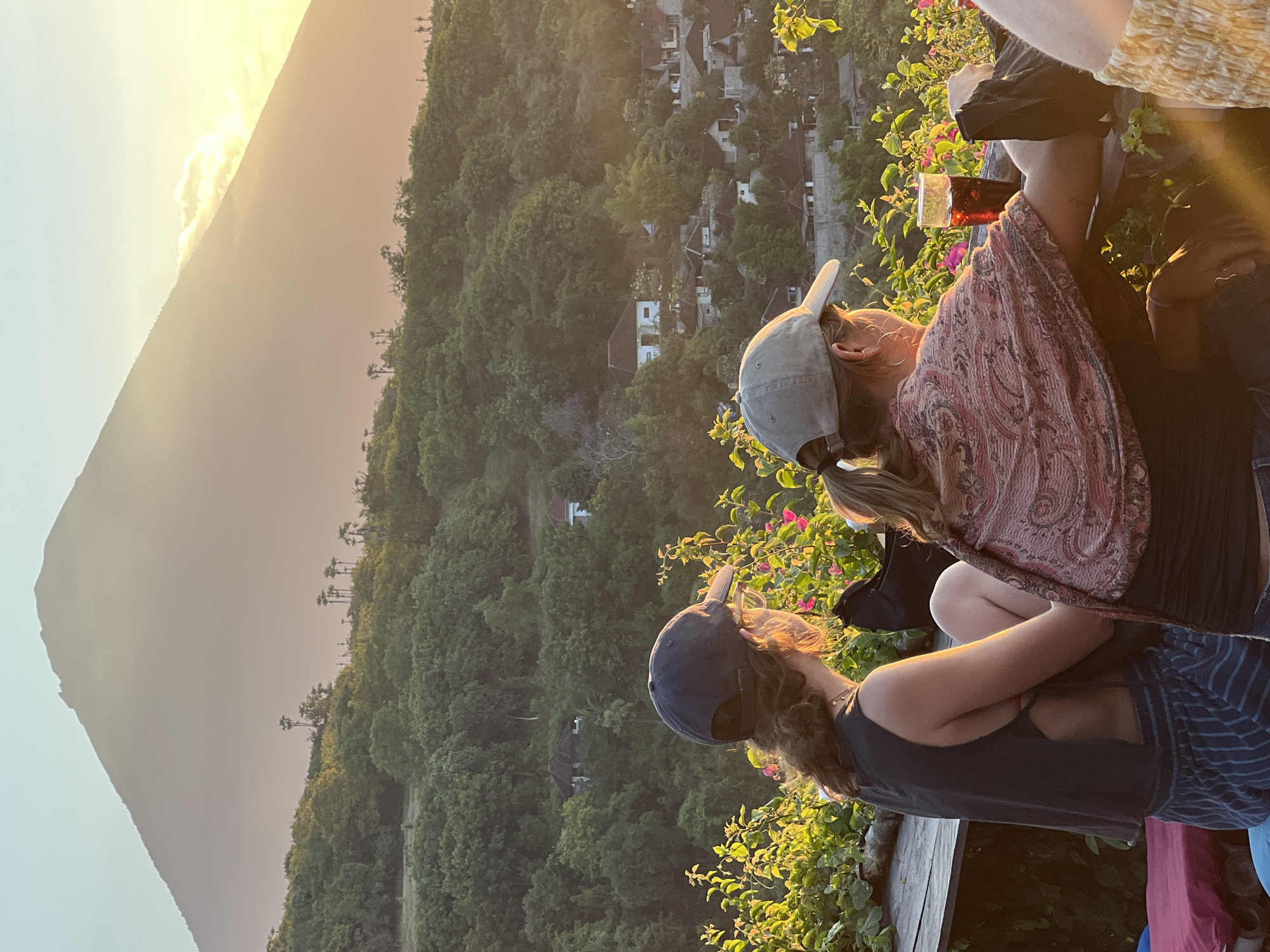 Sunset drinks and views at a hilltop deck near Mount Agung