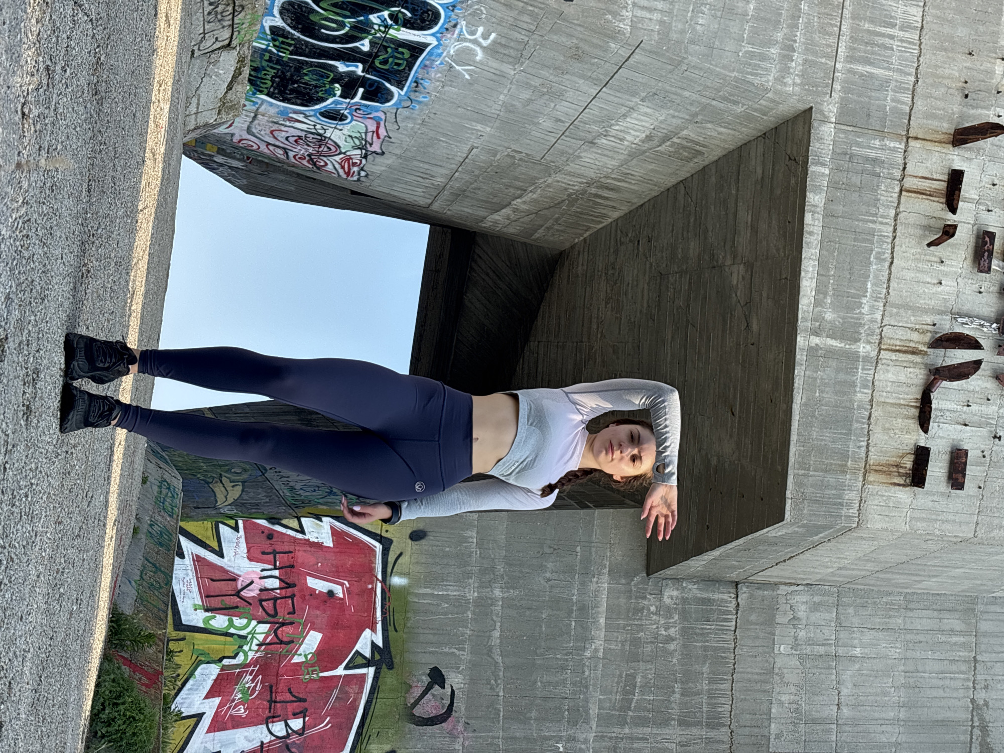 Early morning fitness session photographed under concrete structures in Varna