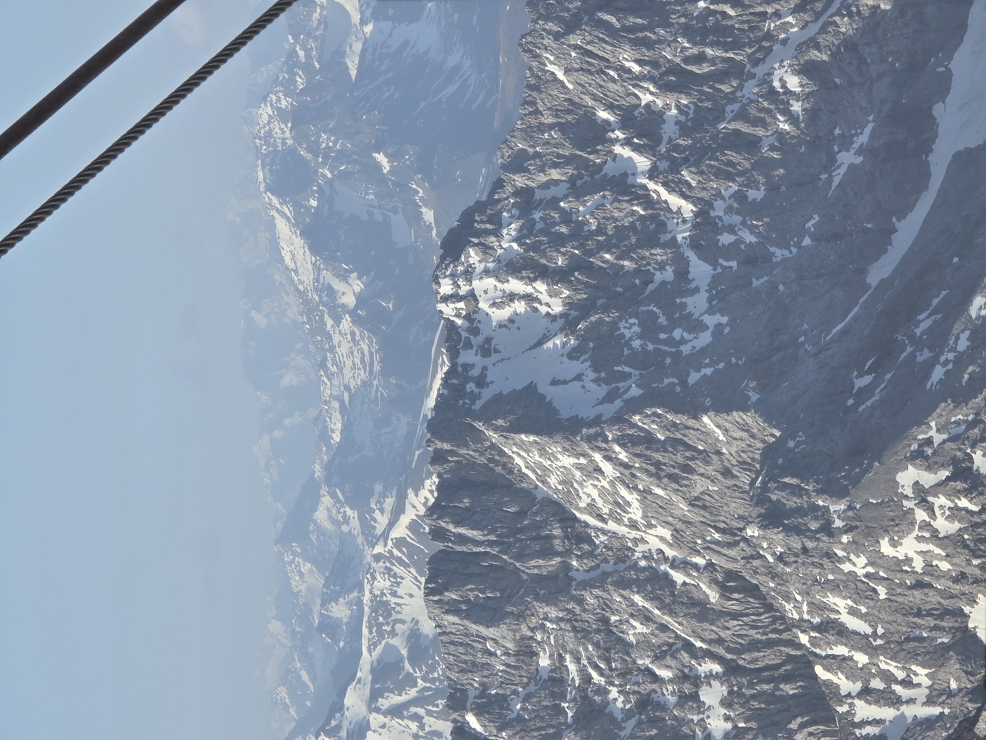 Cable car riders document Alpine views near Grainau, Germany