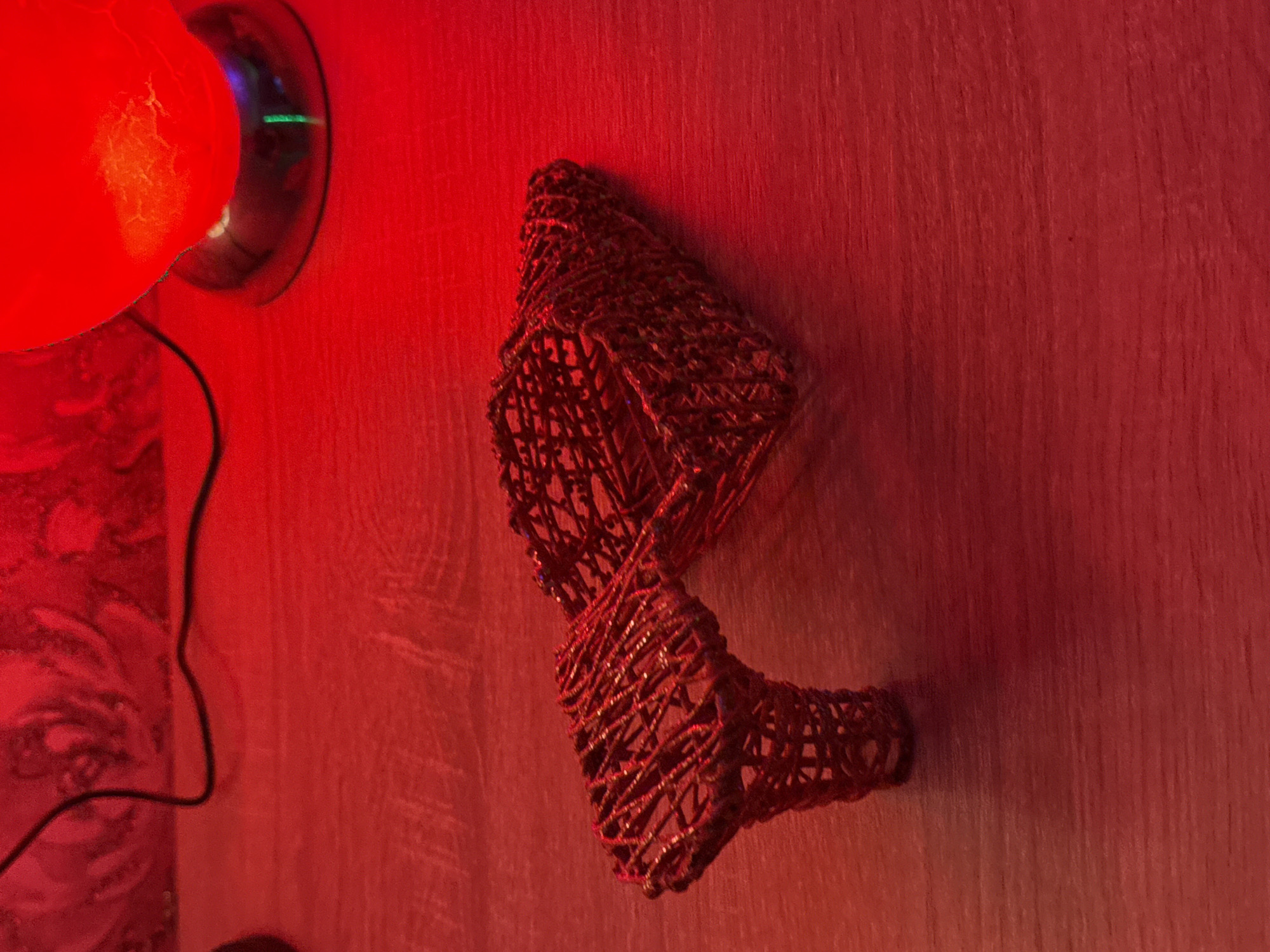 Indoor art photography session with colored lighting and sculptural objects