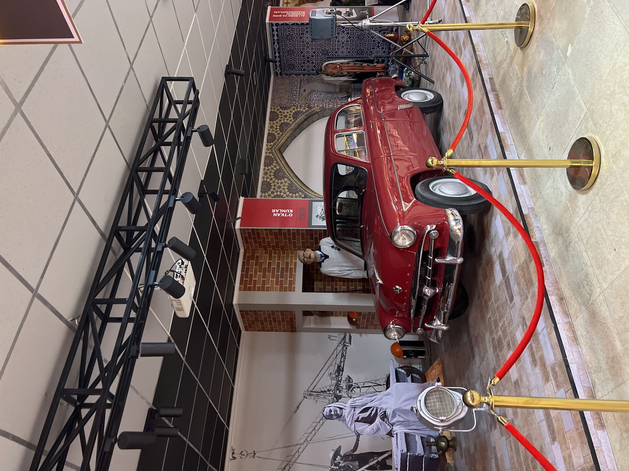 Vintage red car displayed at Tashkent museum exhibit