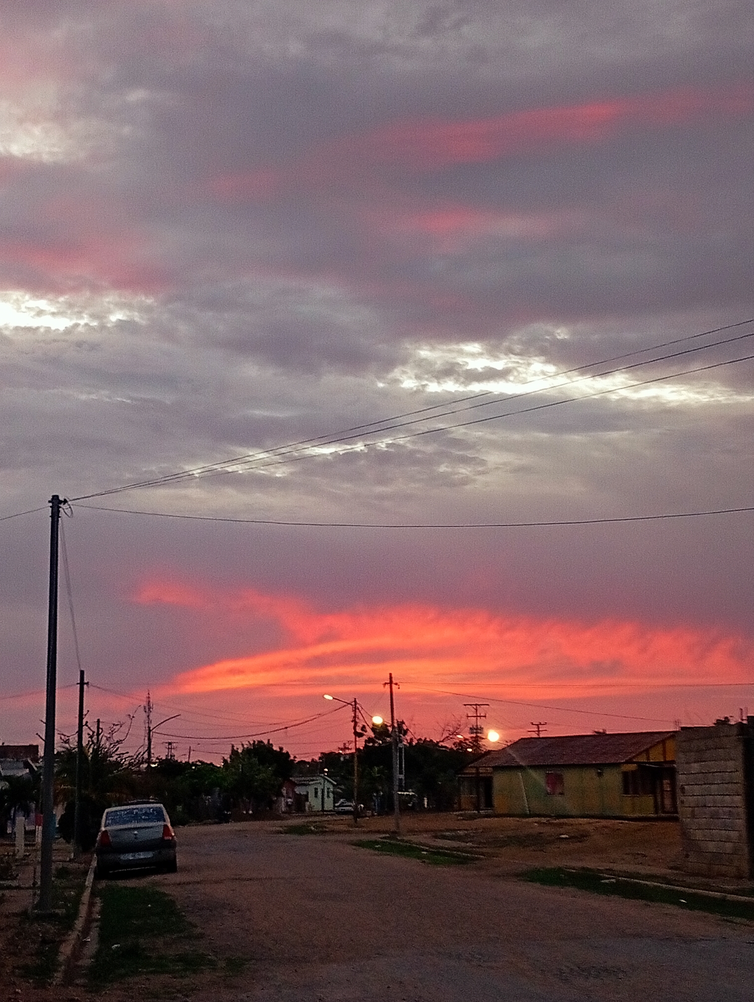 Dramatic sunset documented across Juan Griego, Venezuela streets and selfies