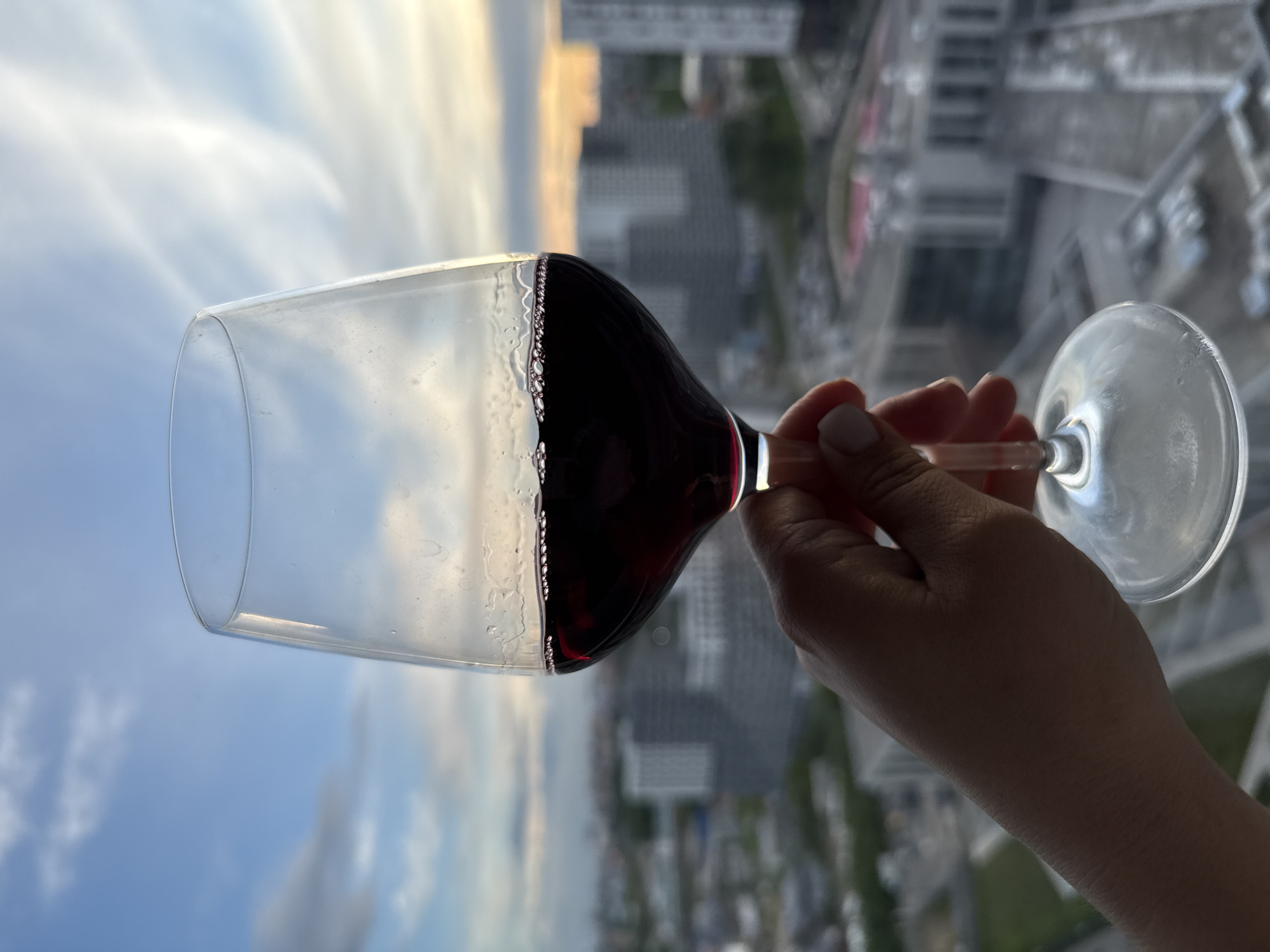 Evening wine moment captured against Lyubertsy sunset skyline