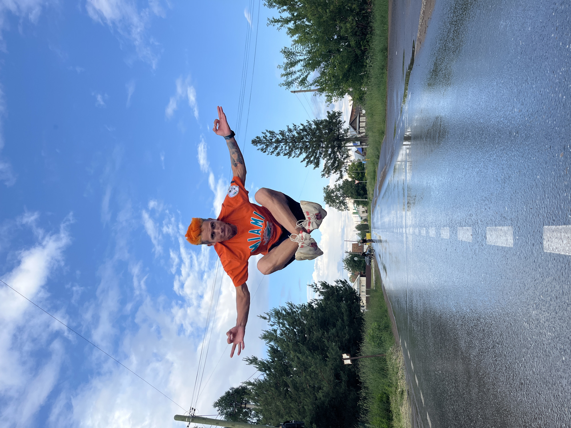 Young men perform stunts on flooded roads in Chaikovsky