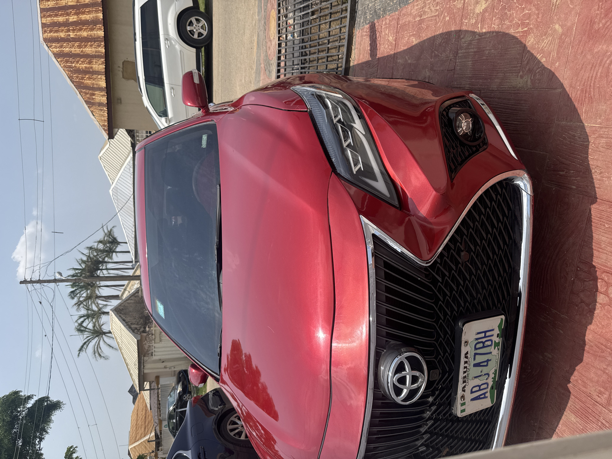 Everyday life across an Abuja neighborhood on a Friday afternoon