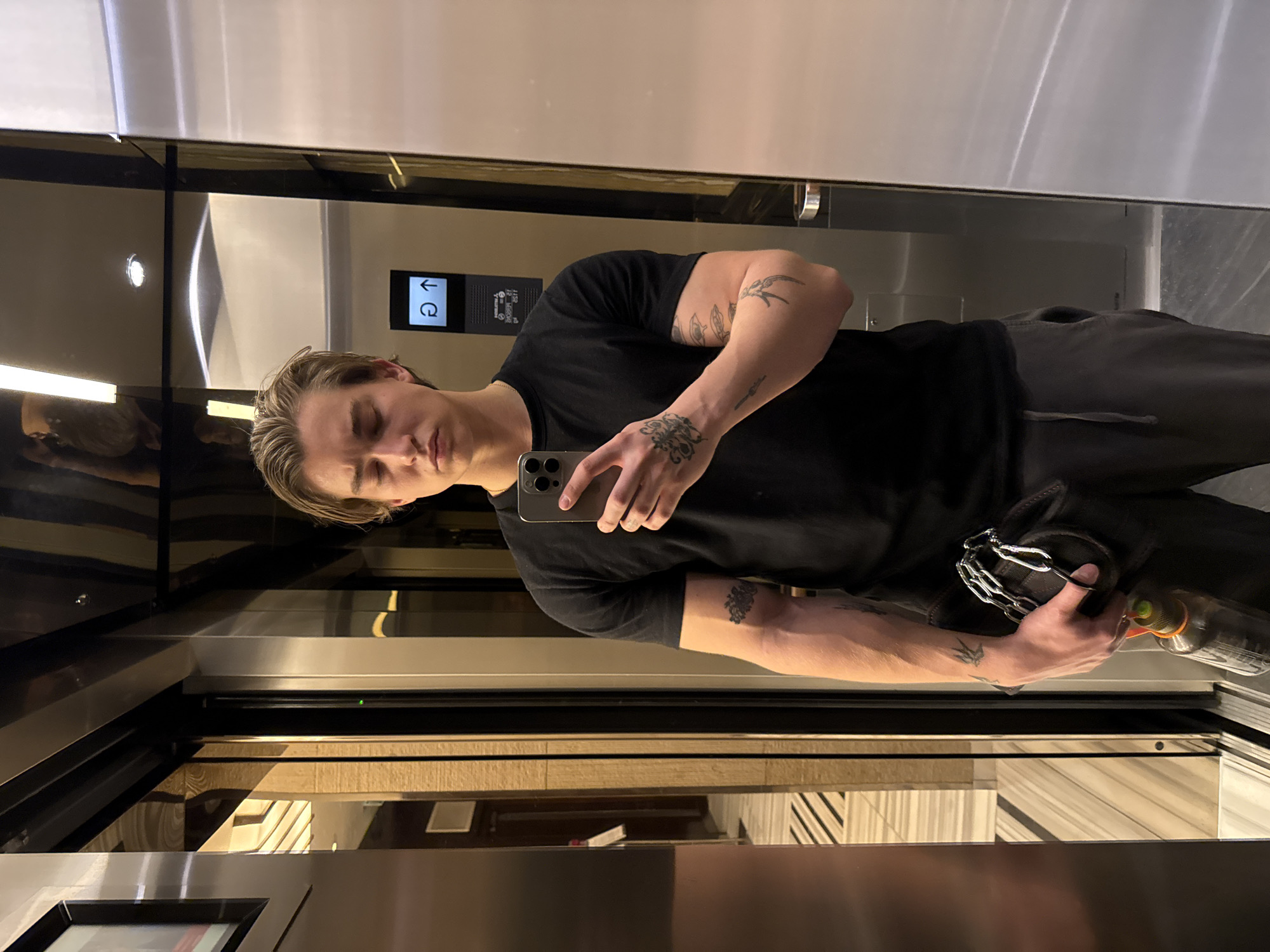 Young man takes mirror selfies in London elevator and gym