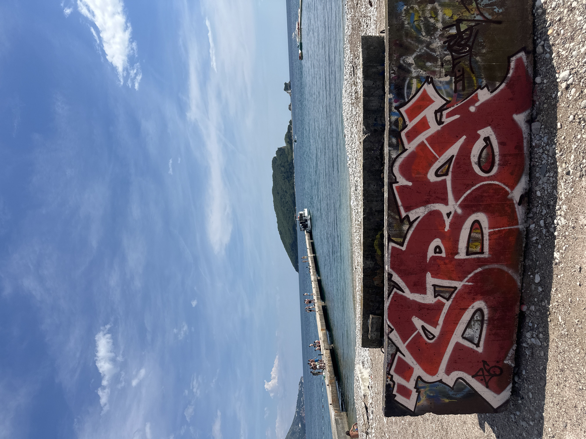 Adriatic pier and rocky beach documented in Budva, Montenegro