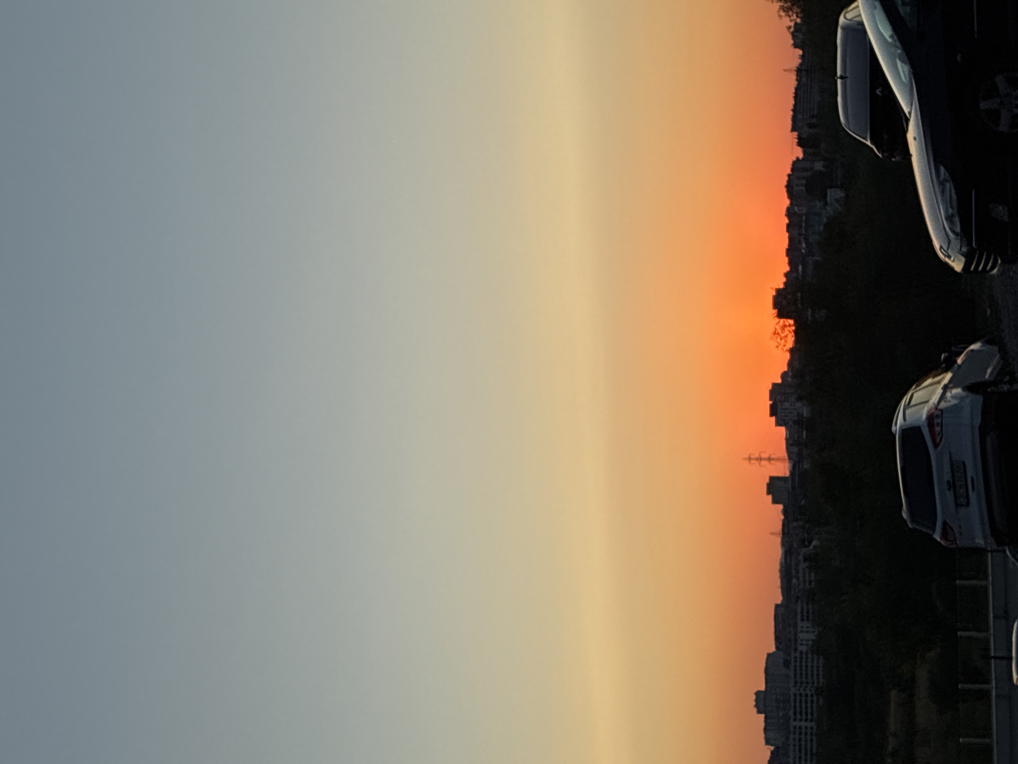 Sunset over Sofia's skyline, shot from above at golden hour