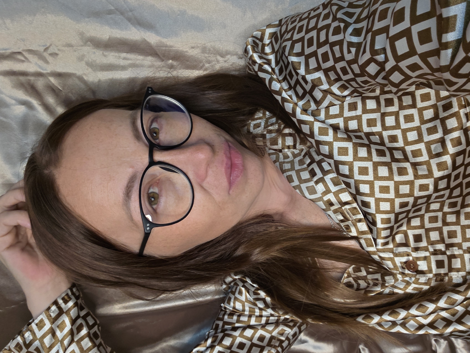Cozy night in with satin sheets, a book, and downtime