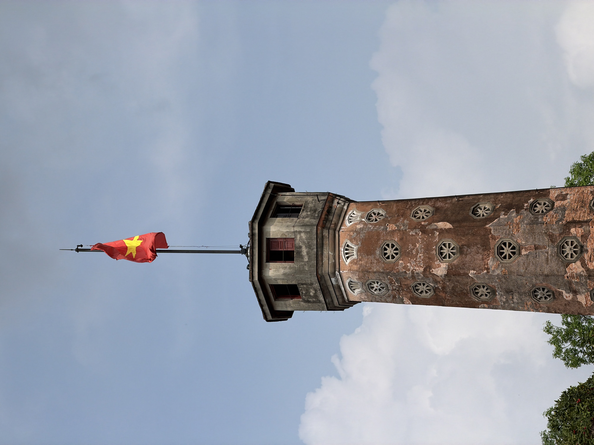 Vietnamese flag flies atop historic Hanoi tower