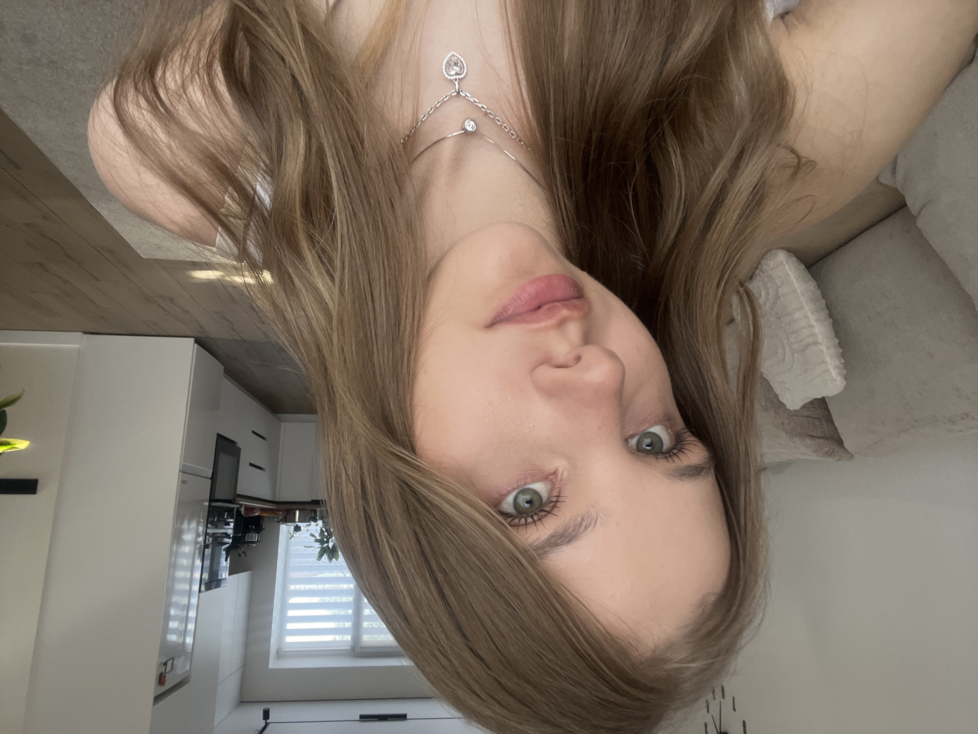 Woman takes playful selfies at home in Votkinsk