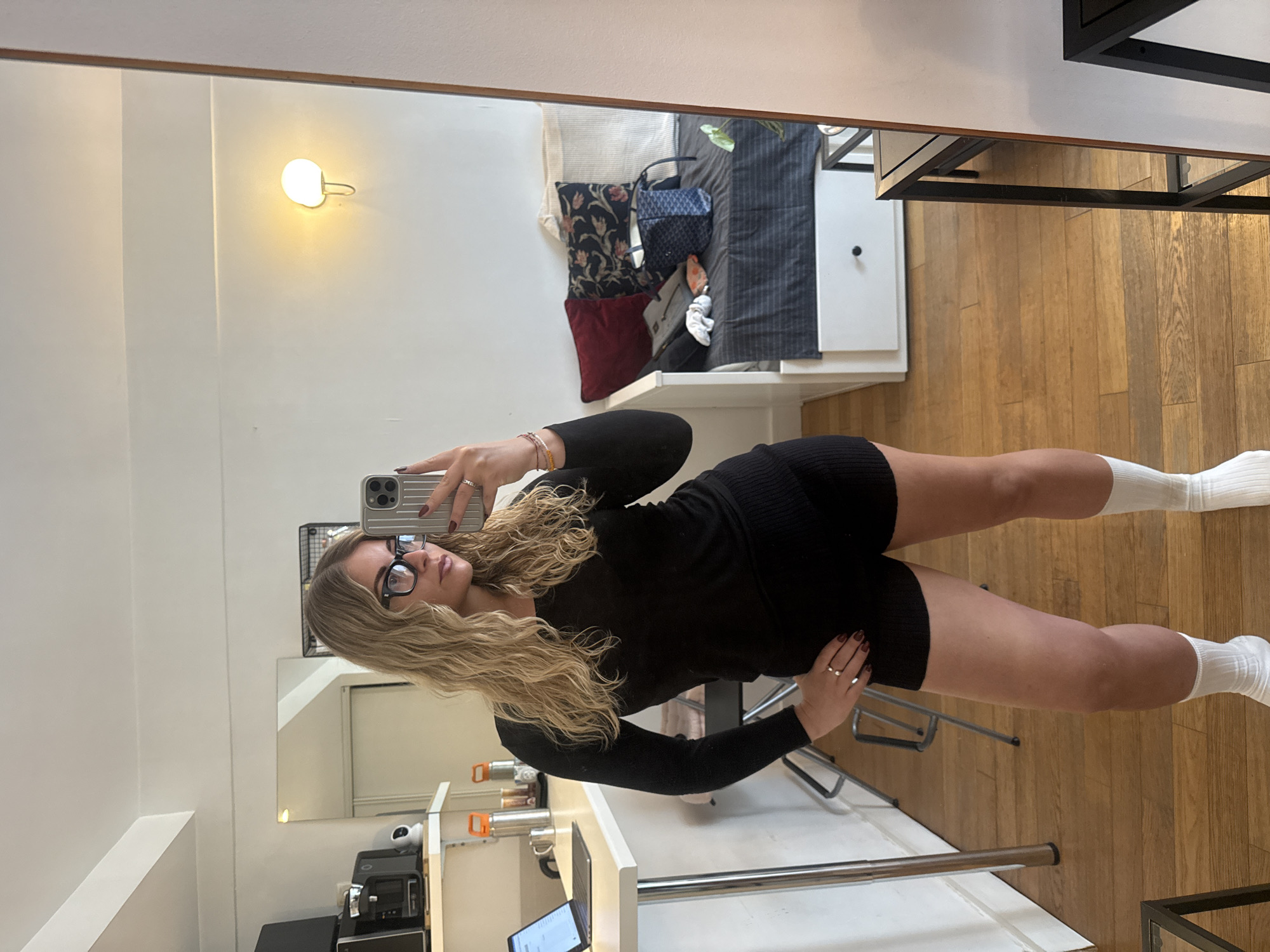 Woman takes selfies in Paris apartment