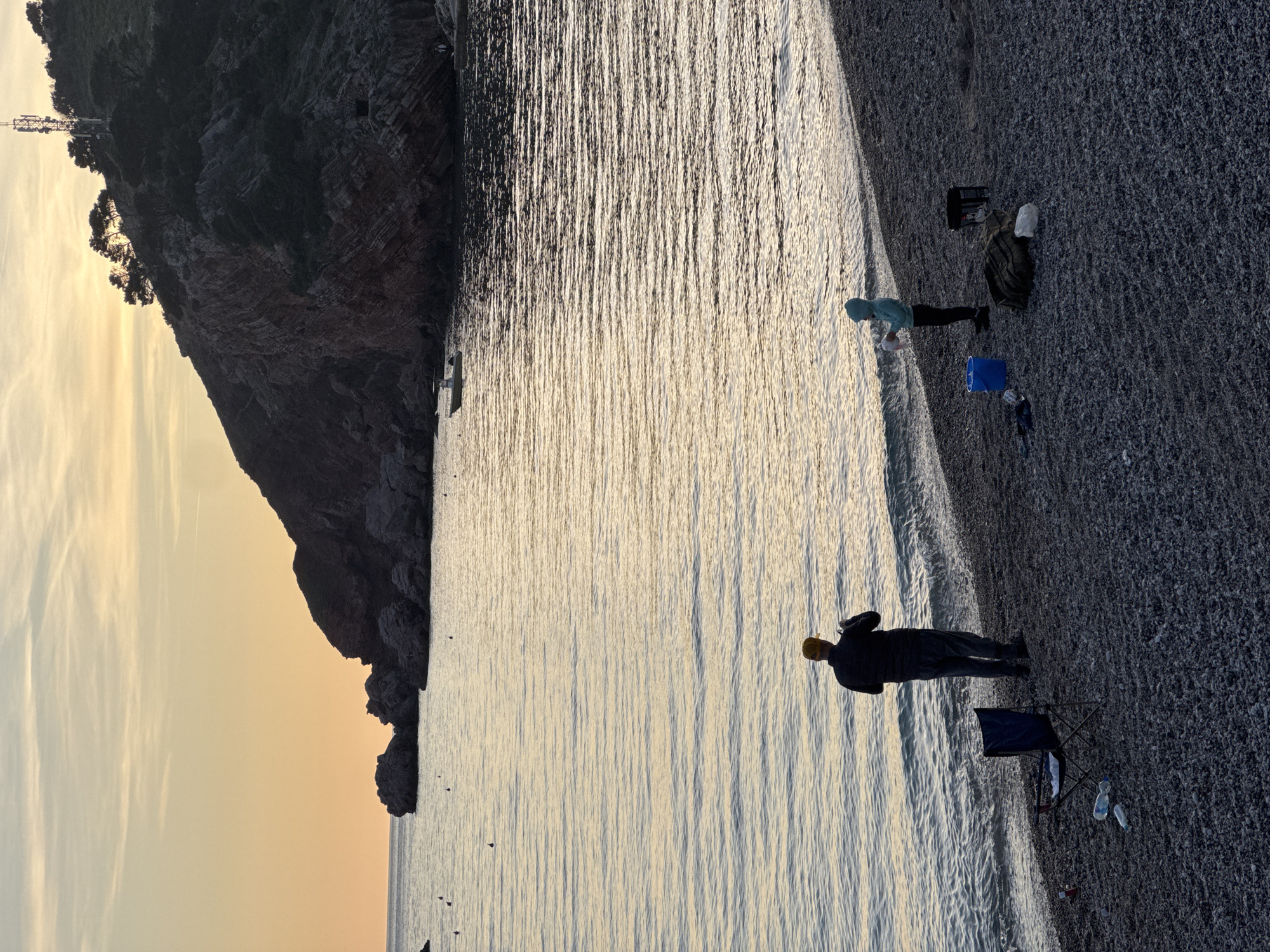Person walks three dogs on concrete ramp in Montenegro